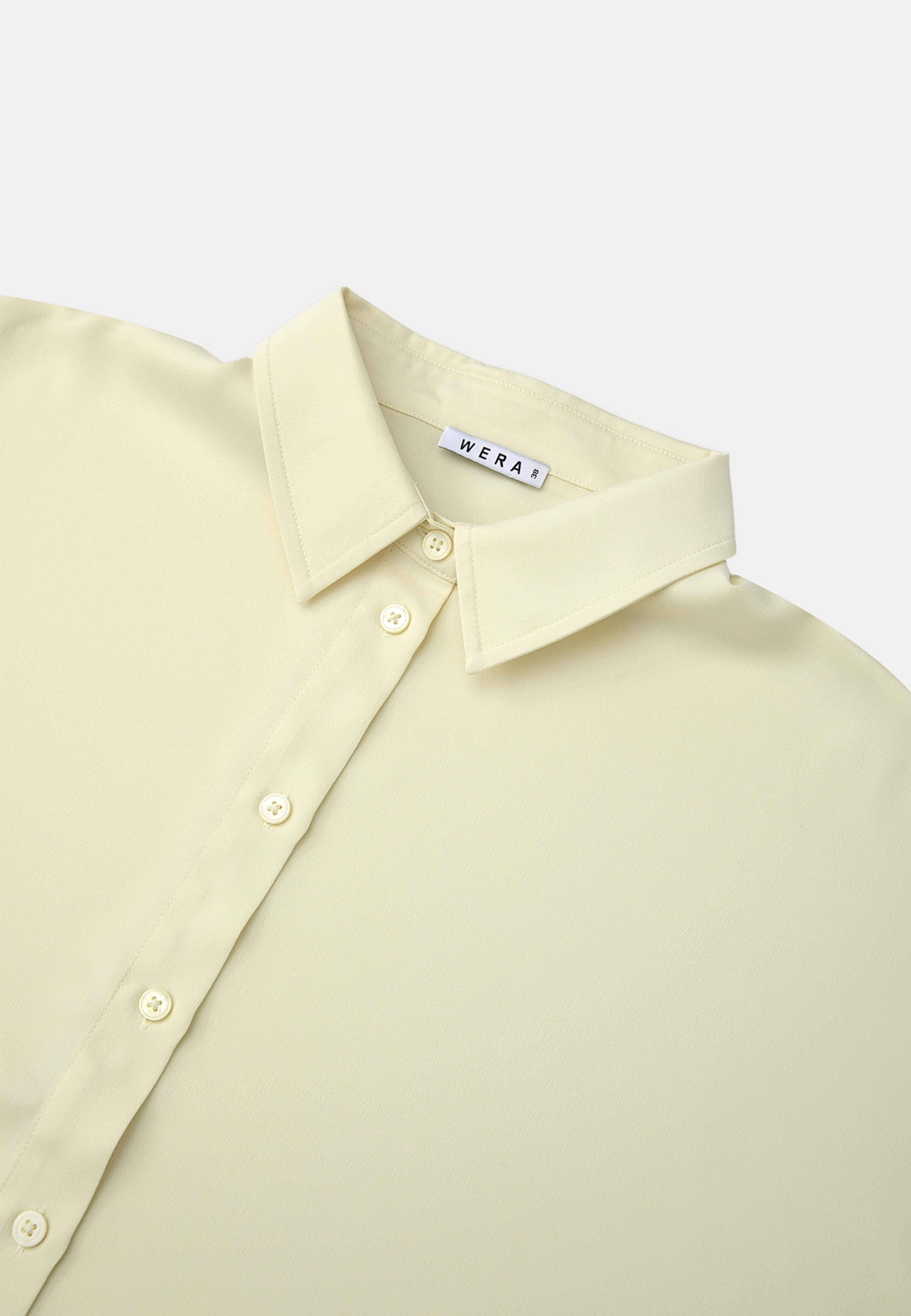 Blus med holkärm LIA, från Wera, i färgen Light Yellow. Klicka för att öppna bilden i stort format