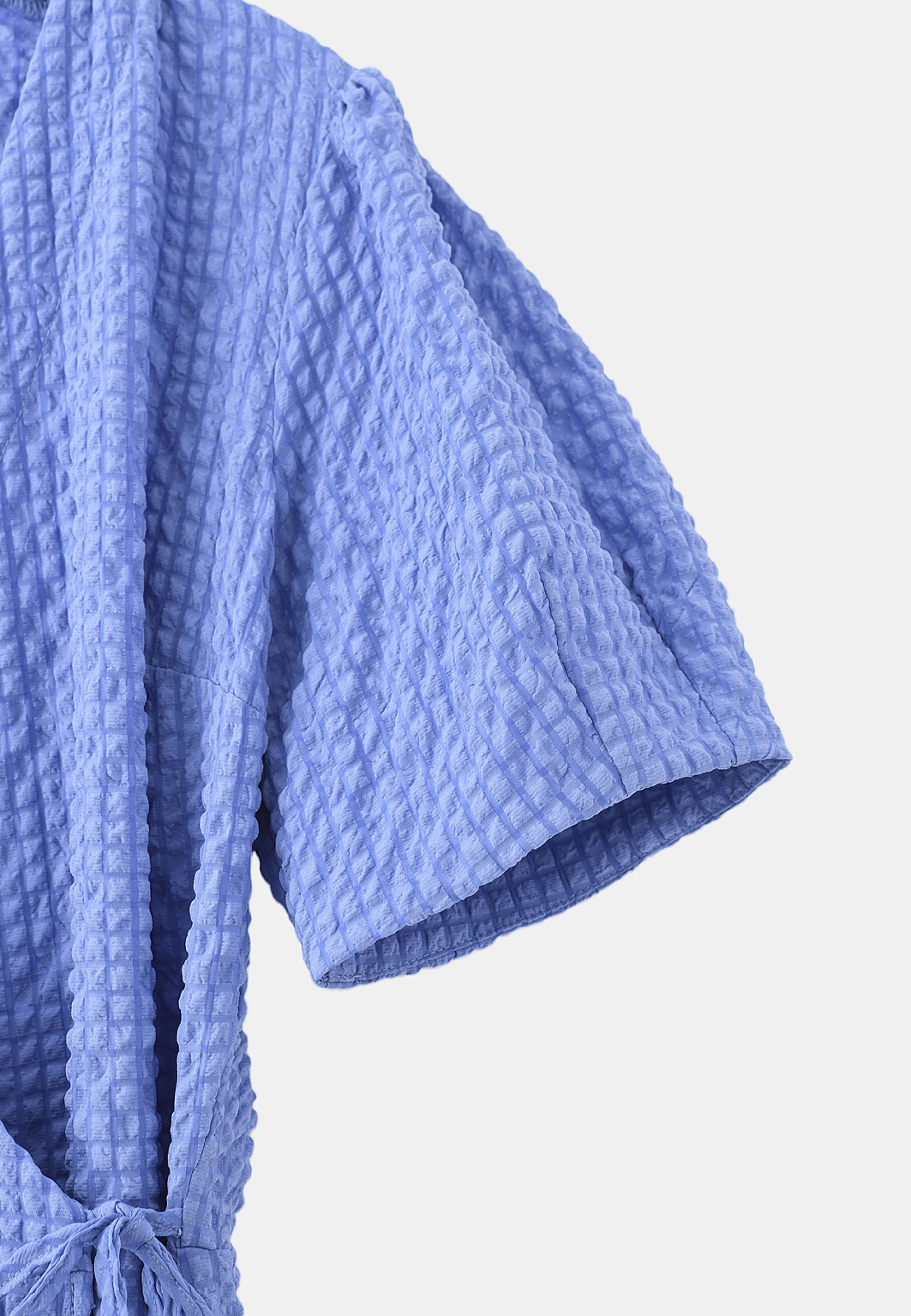 Omlottklänning AUGUSTI, från Carin Wester, i färgen Mid Blue. Klicka för att öppna bilden i stort format