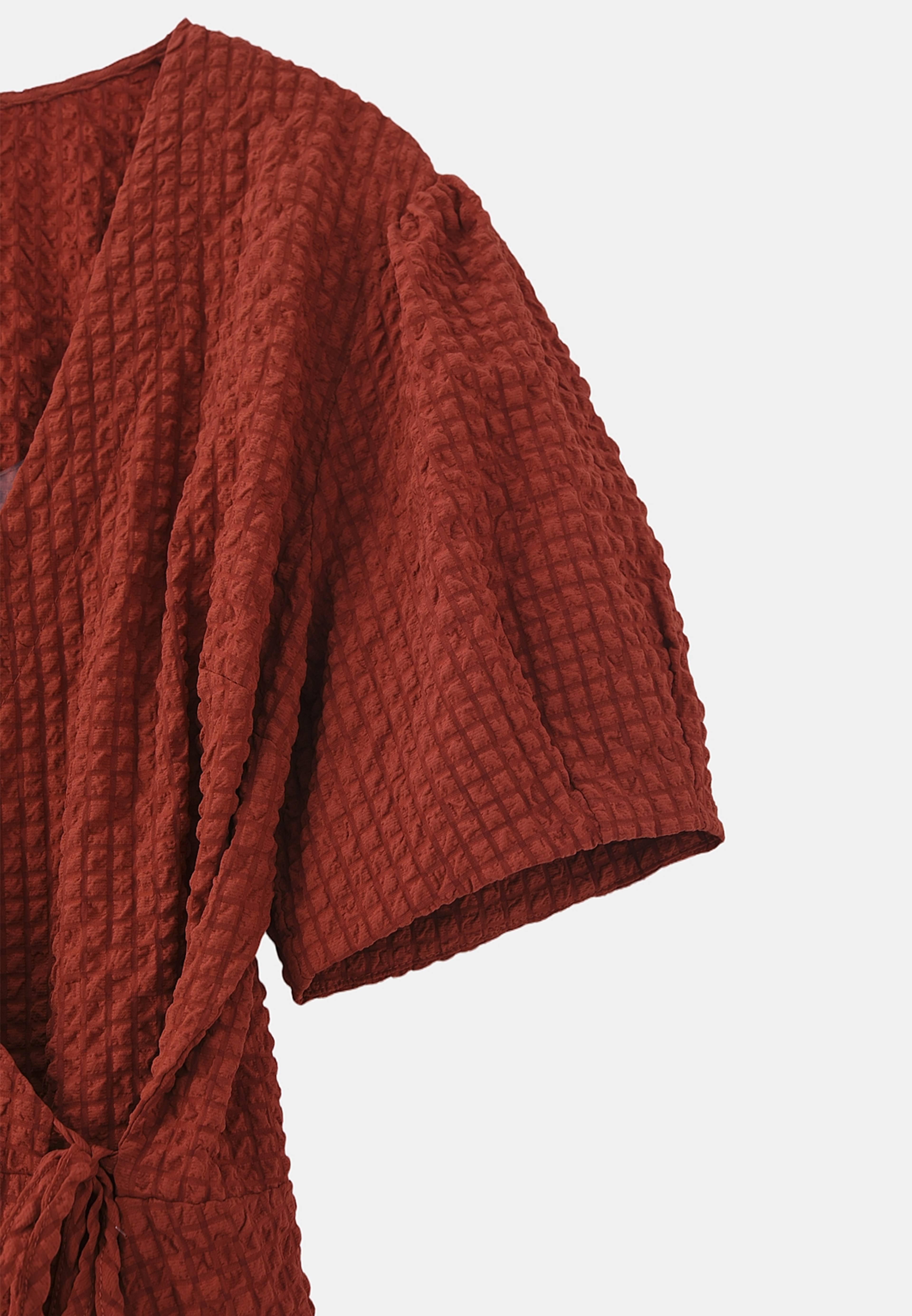 Omlottklänning AUGUSTI, från Carin Wester, i färgen Rust Red. Klicka för att öppna bilden i stort format