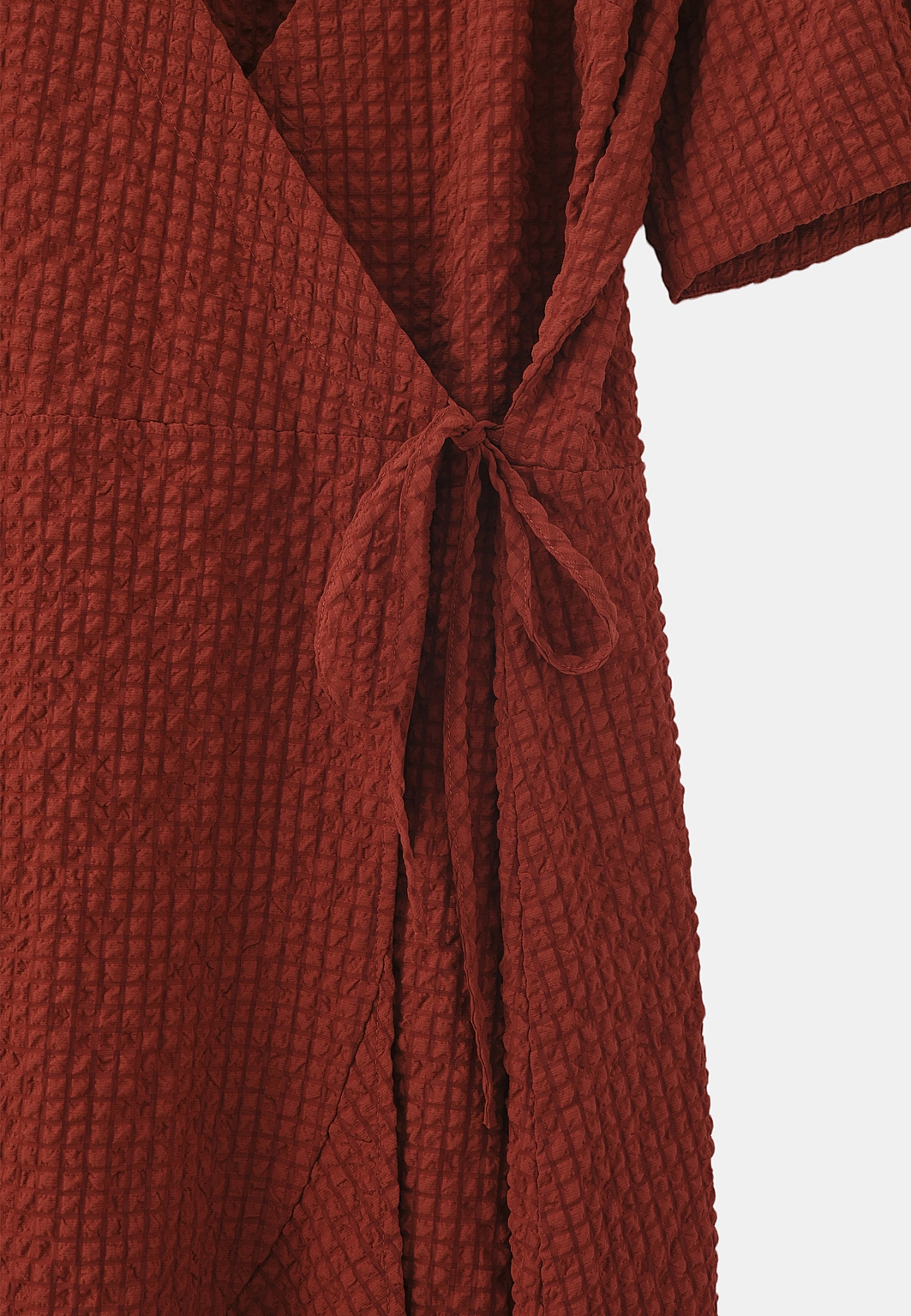 Omlottklänning AUGUSTI, från Carin Wester, i färgen Rust Red. Klicka för att öppna bilden i stort format