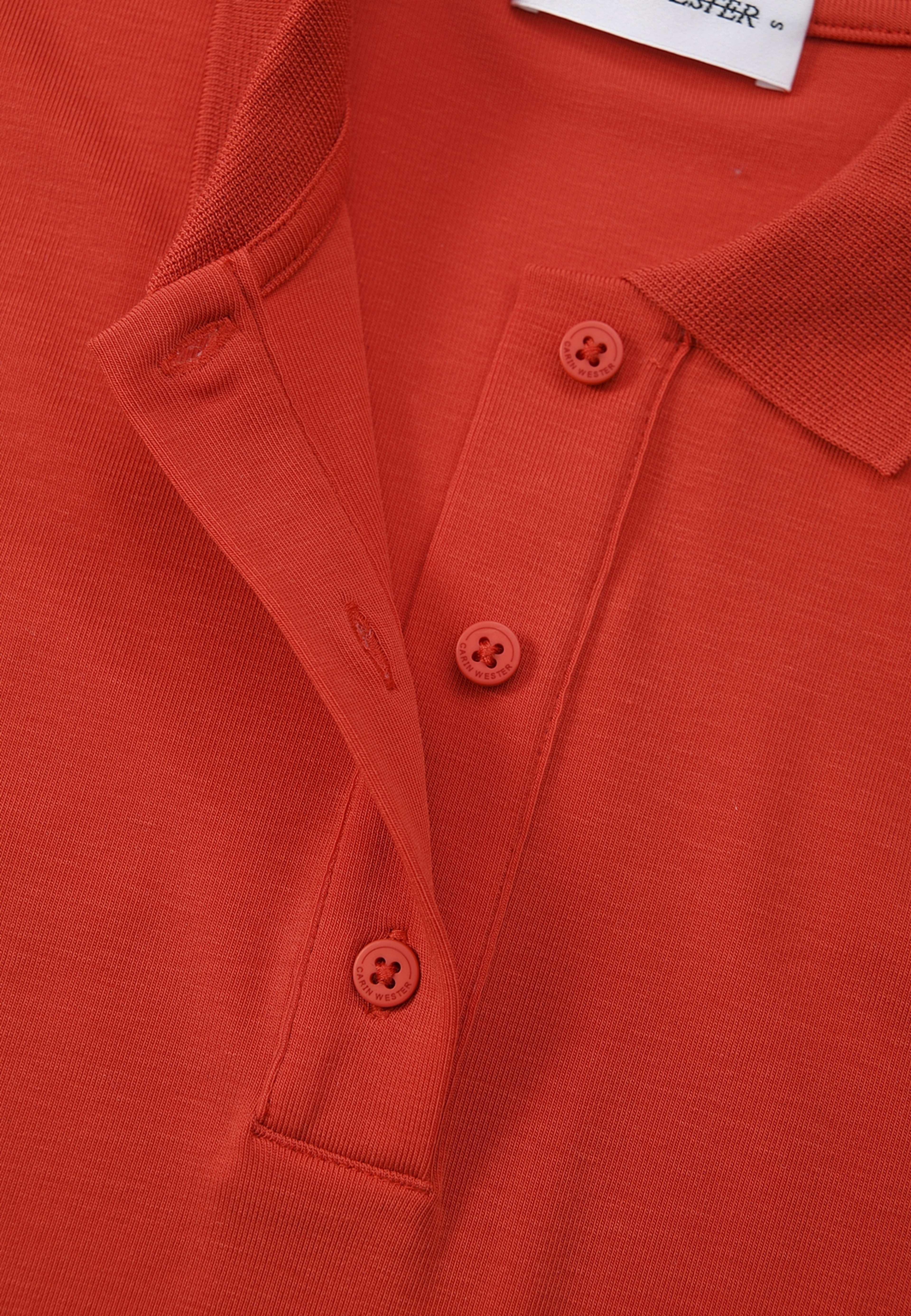 Pikétröja i lyocell IZMA, från Carin Wester, i färgen Rust Red. Klicka för att öppna bilden i stort format