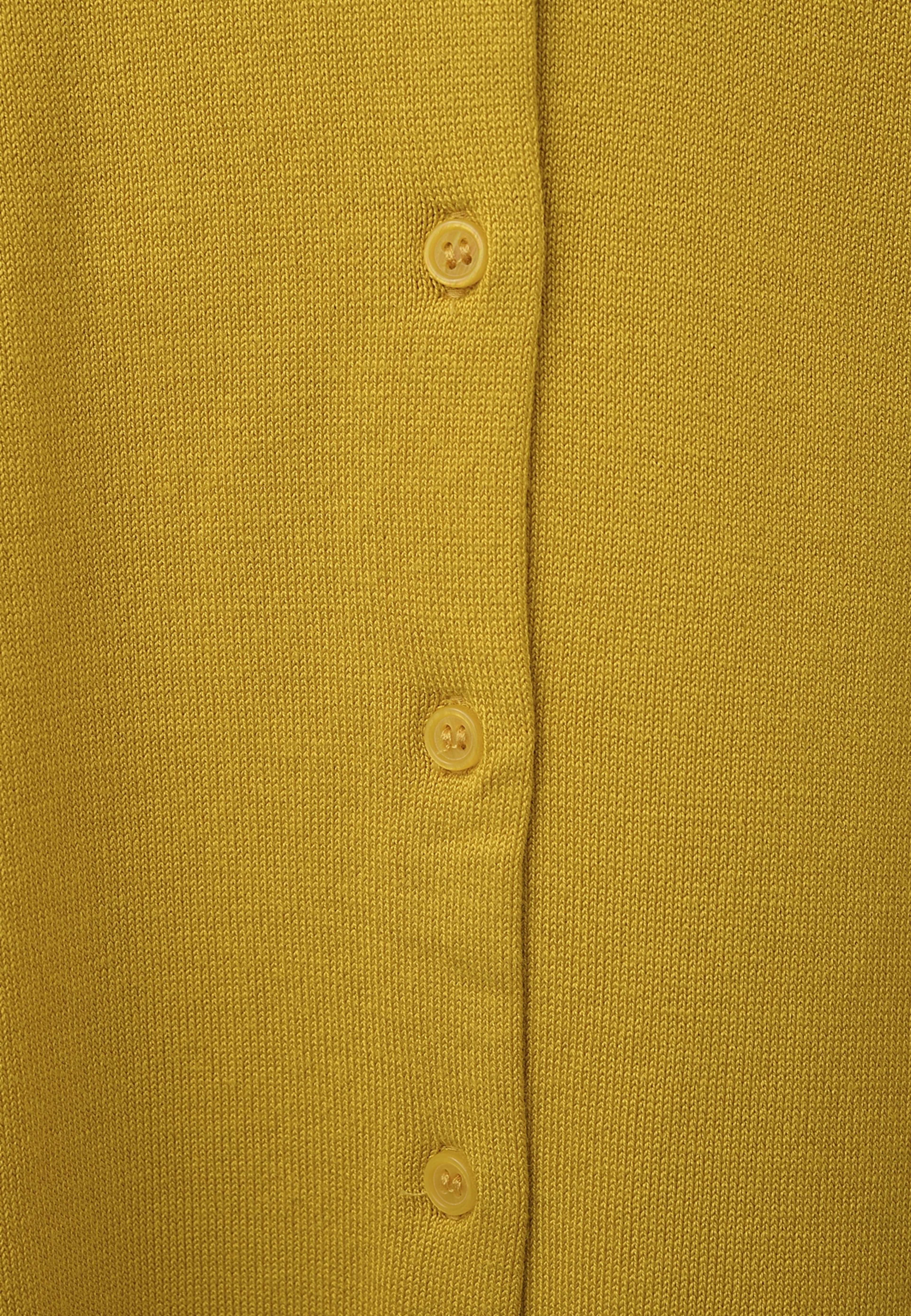 Cardigan INGRID, från Å WOMAN, i färgen Dark Yellow. Klicka för att öppna bilden i stort format