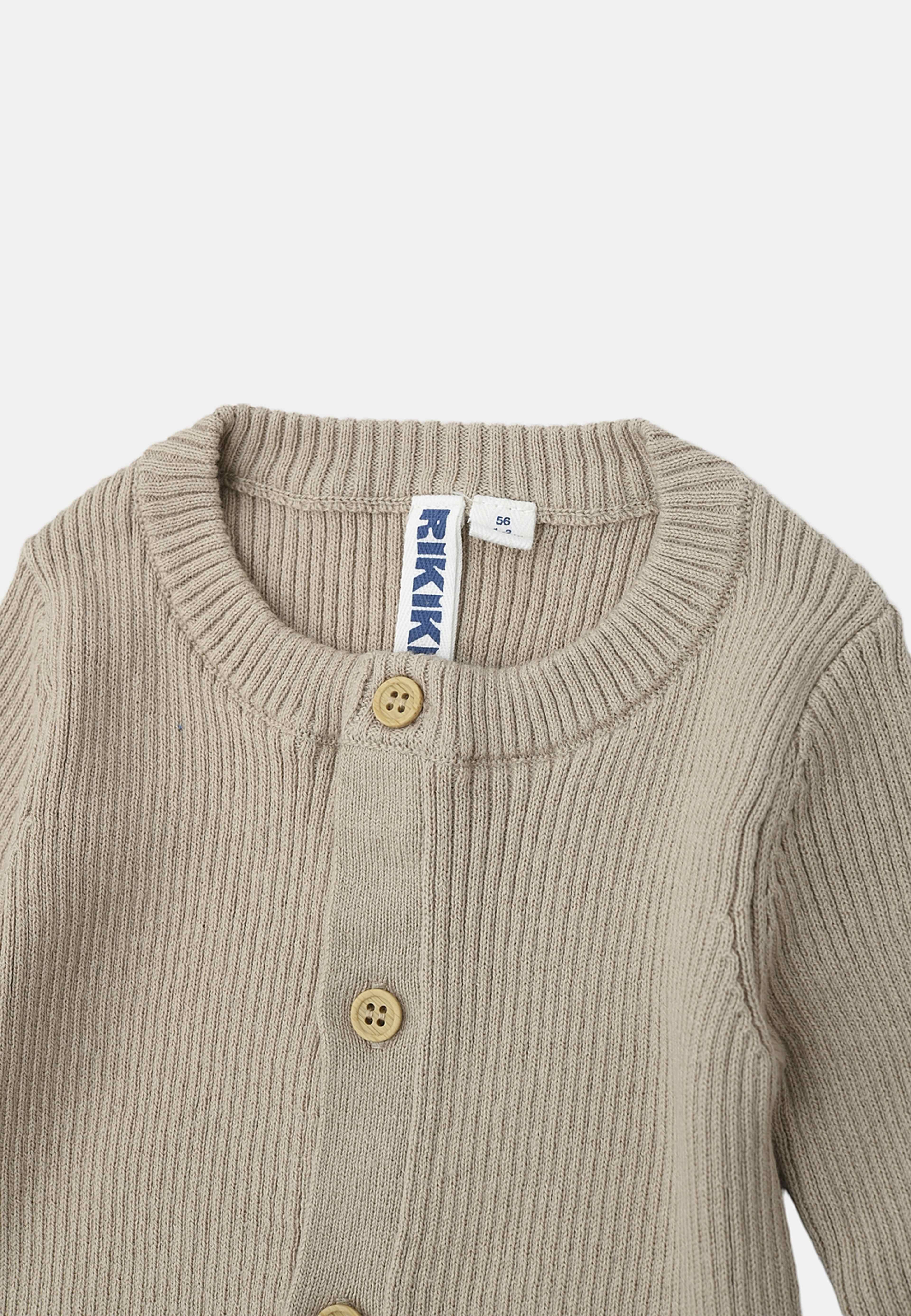 Ribbstickad onesie STIG, från RIKIKI, i färgen Beige. Klicka för att öppna bilden i stort format