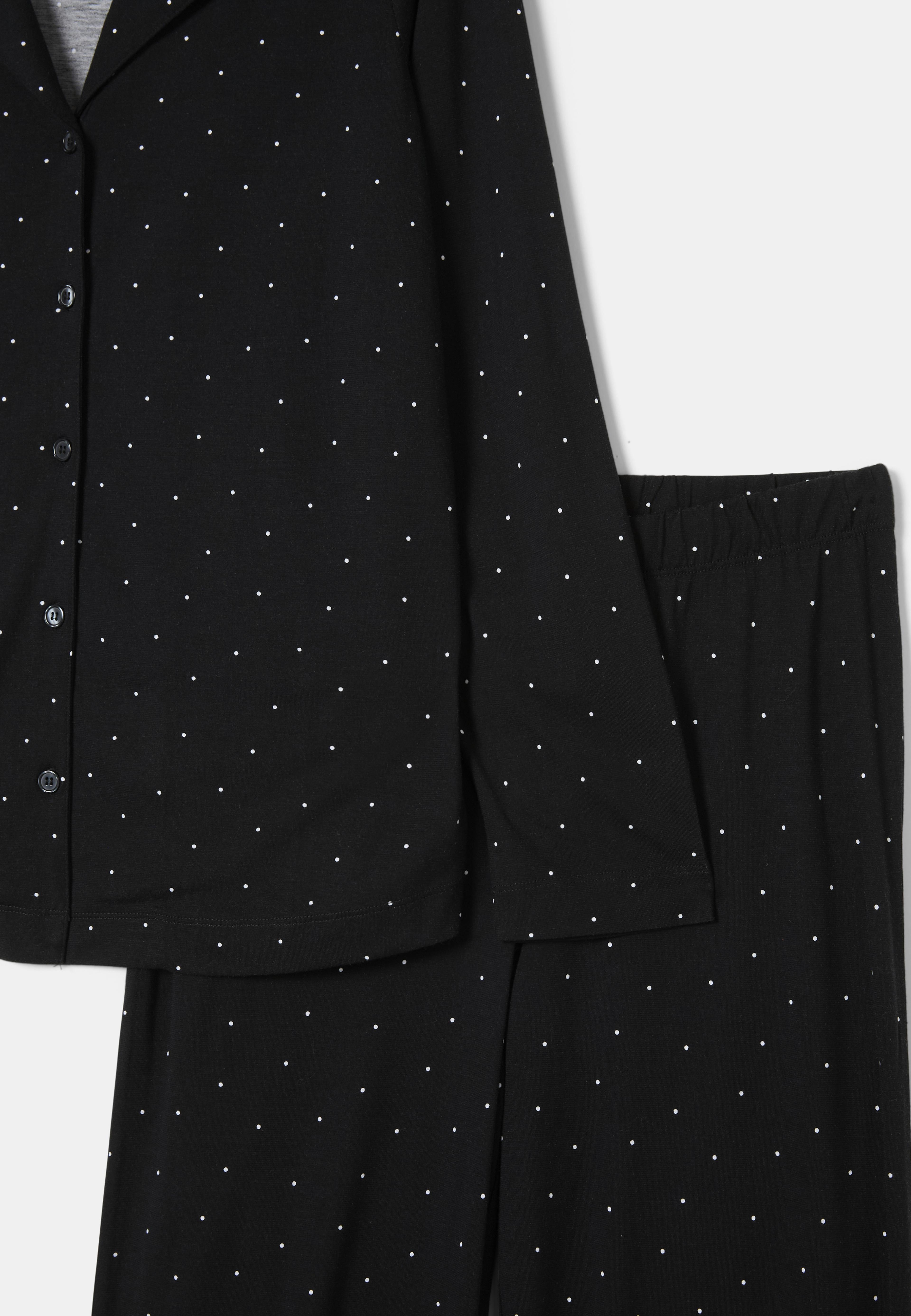 Pyjamas UMA, från Å WOMAN, i färgen Black Dot. Klicka för att öppna bilden i stort format
