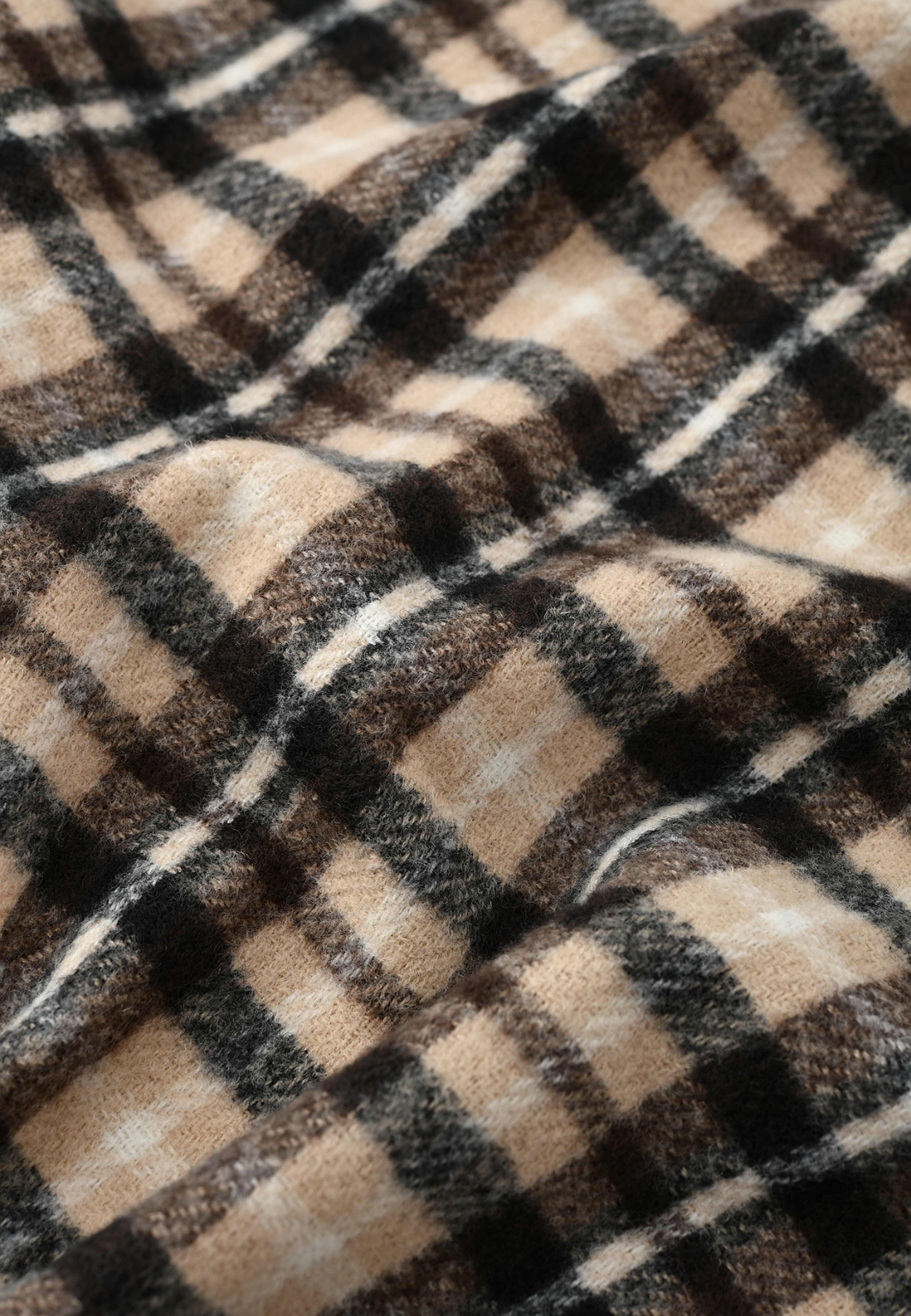 Halsduk med fransar ELLA, från Å WOMAN, i färgen Beige. Klicka för att öppna bilden i stort format