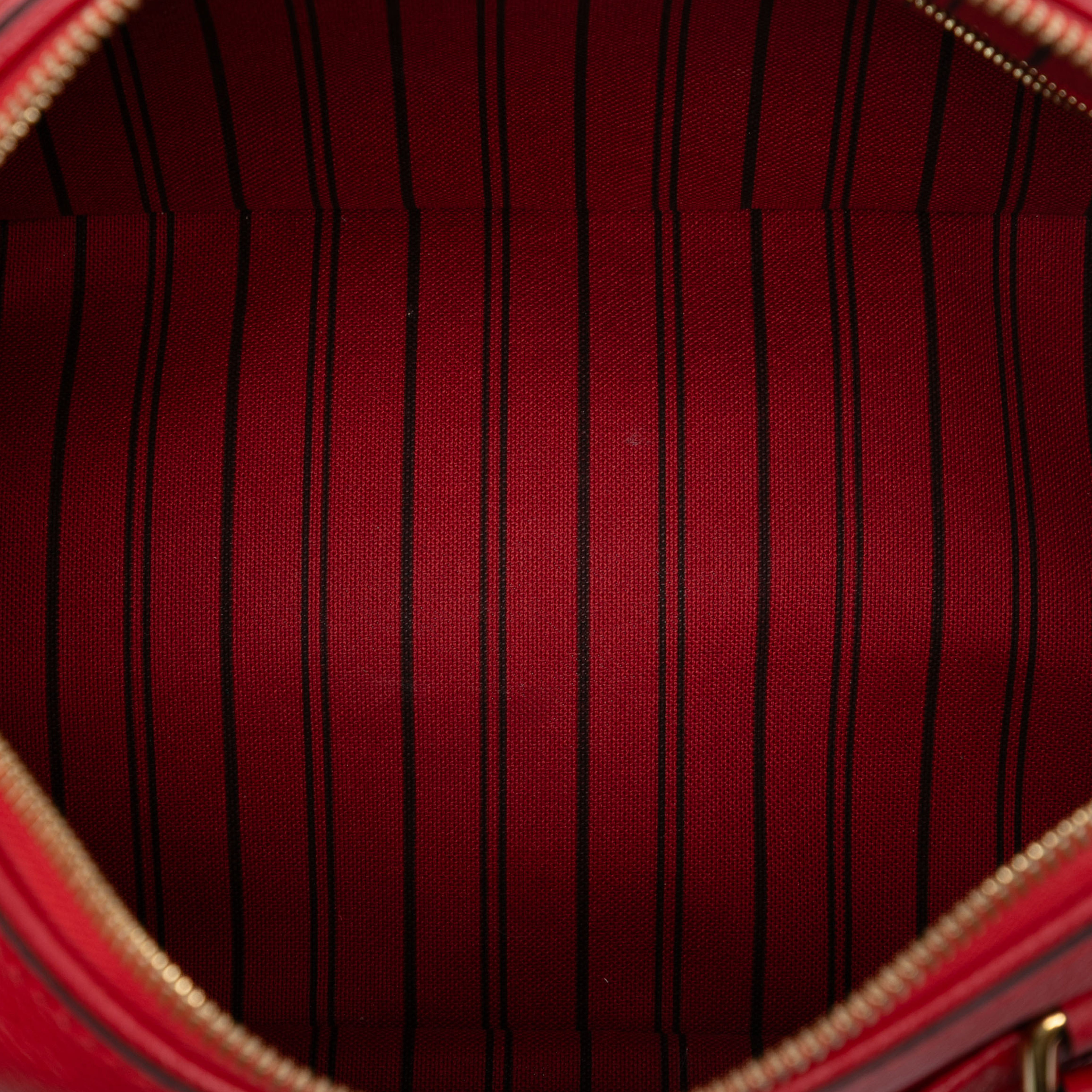 Louis Vuitton Monogram Empreinte Speedy Bandouliere 25, från Luxclusif, i färgen red. Klicka för att öppna bilden i stort format