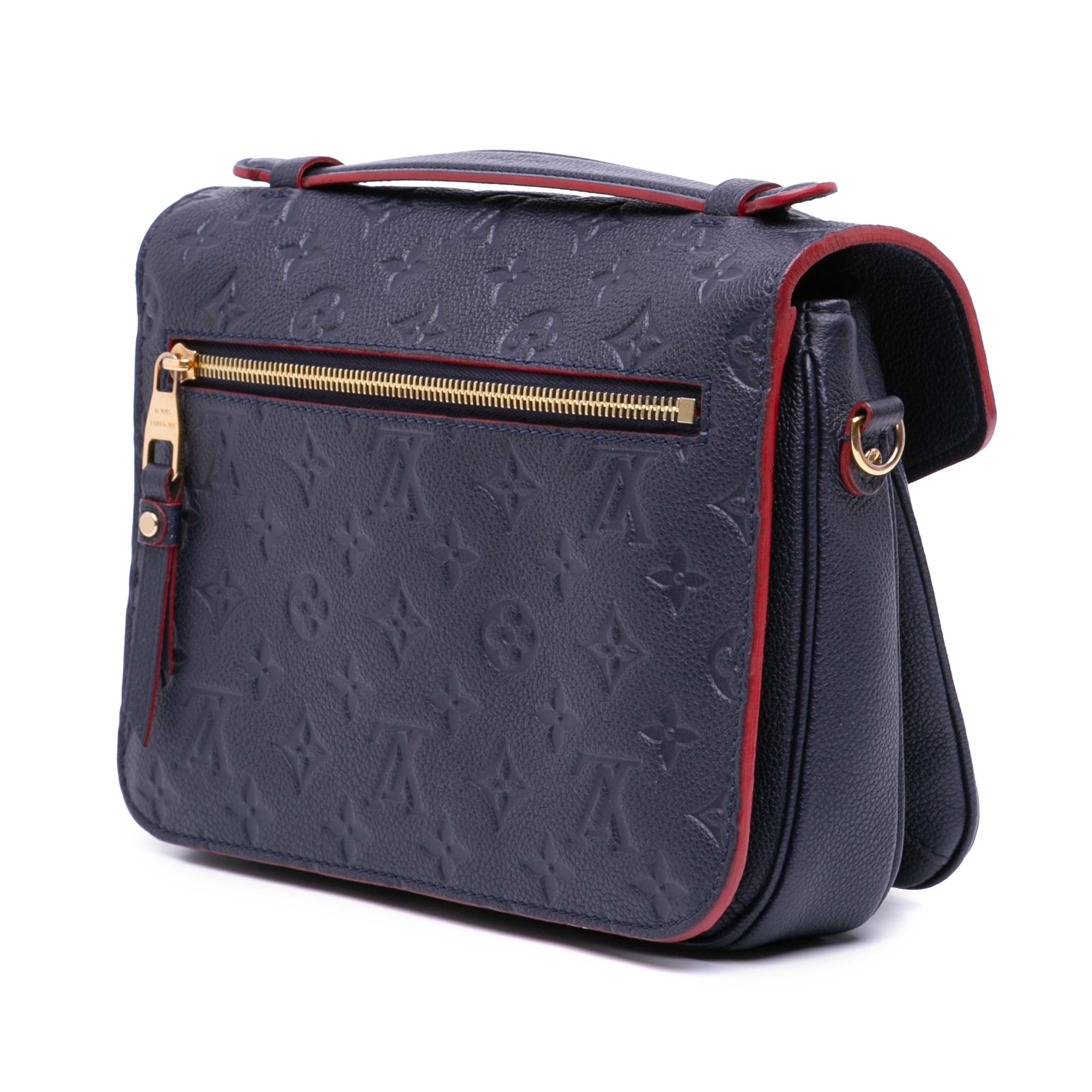 Louis Vuitton Monogram Empreinte Pochette Metis, från Luxclusif, i färgen navy. Klicka för att öppna bilden i stort format