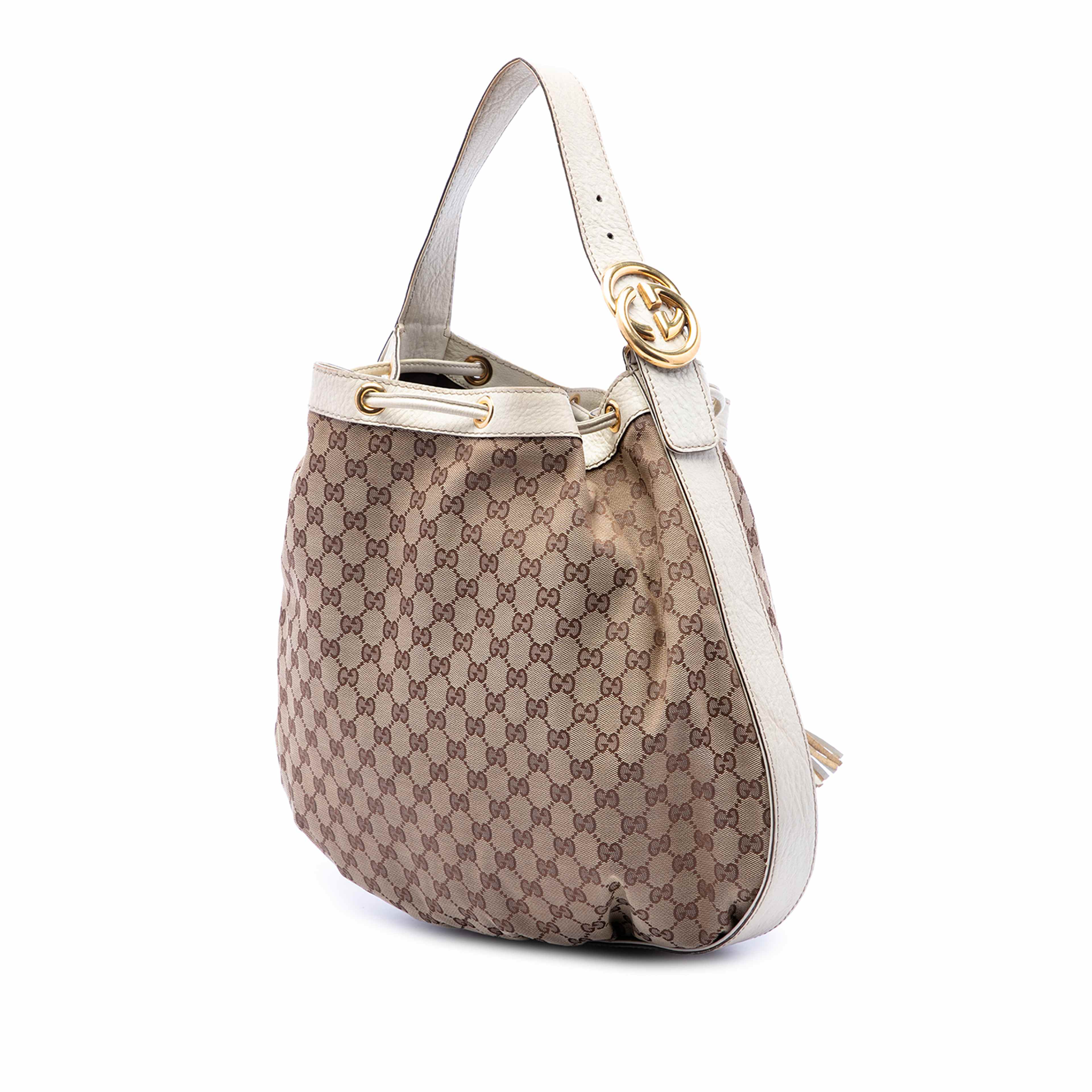 Gucci Gg Canvas Interlocking Icon Drawstring Hobo, från Luxclusif, i färgen beige. Klicka för att öppna bilden i stort format