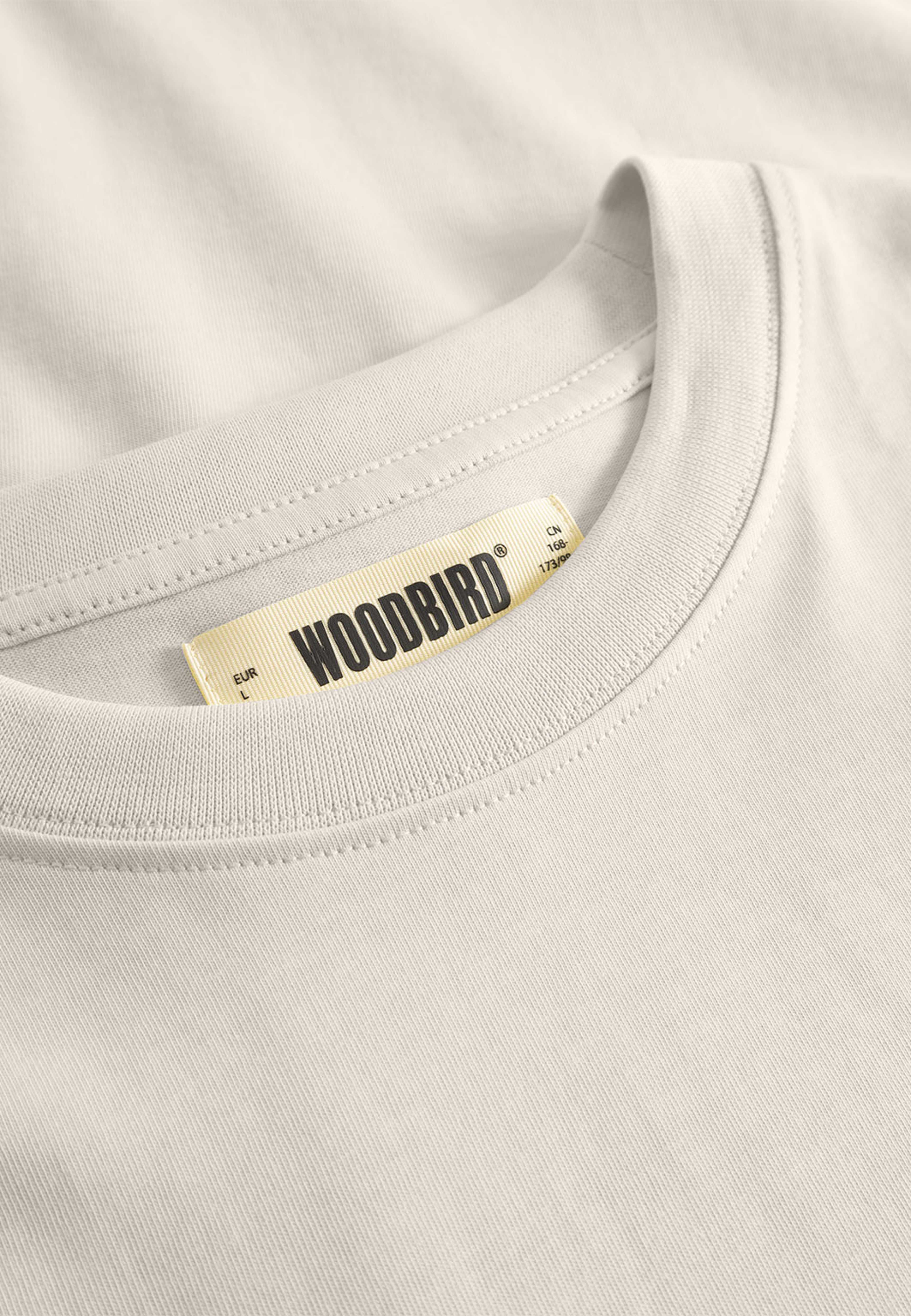 Baine Base tee, från Woodbird, i färgen Light Grey. Klicka för att öppna bilden i stort format