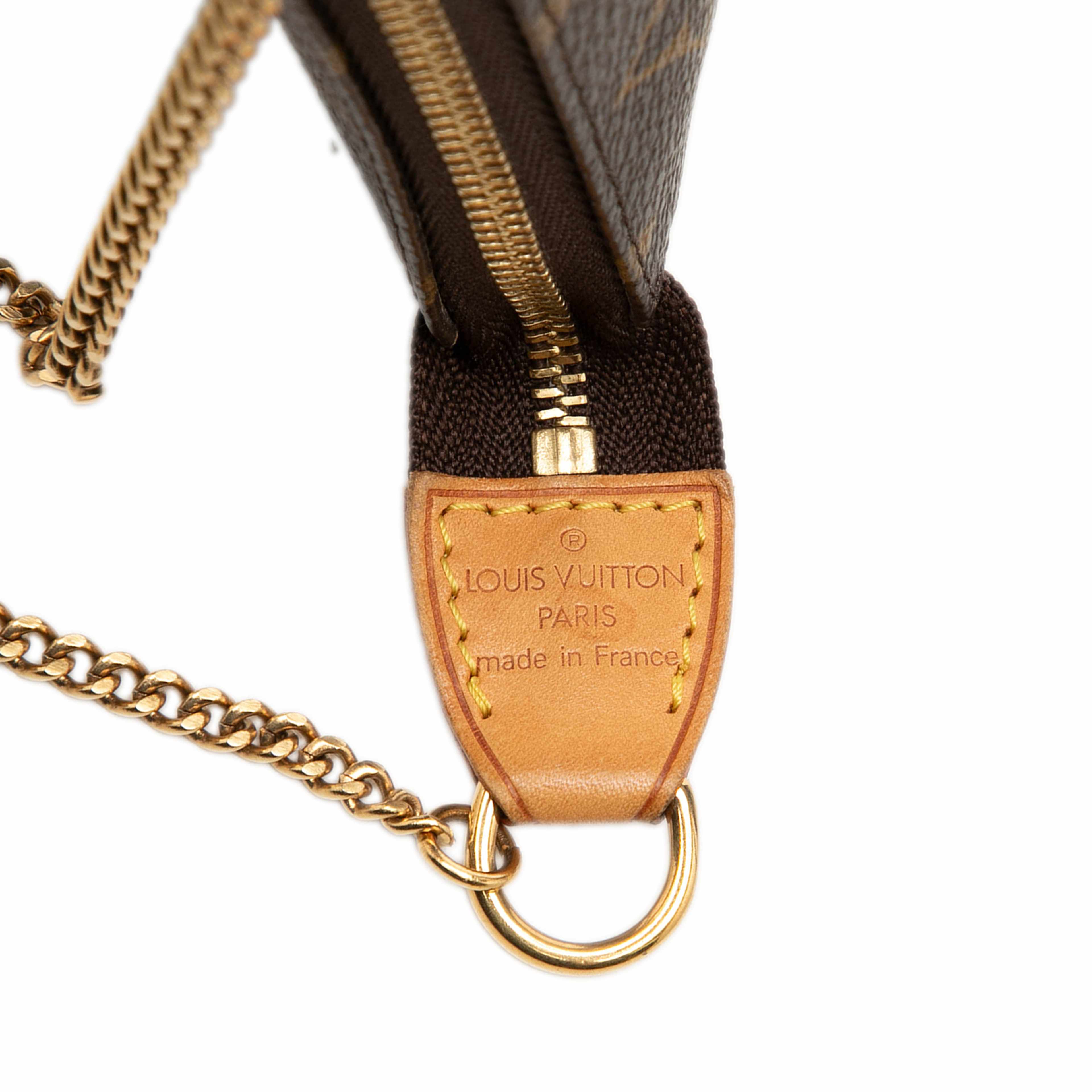 Louis Vuitton Monogram Mini Pochette Accessoires, från Luxclusif, i färgen brun. Klicka för att öppna bilden i stort format