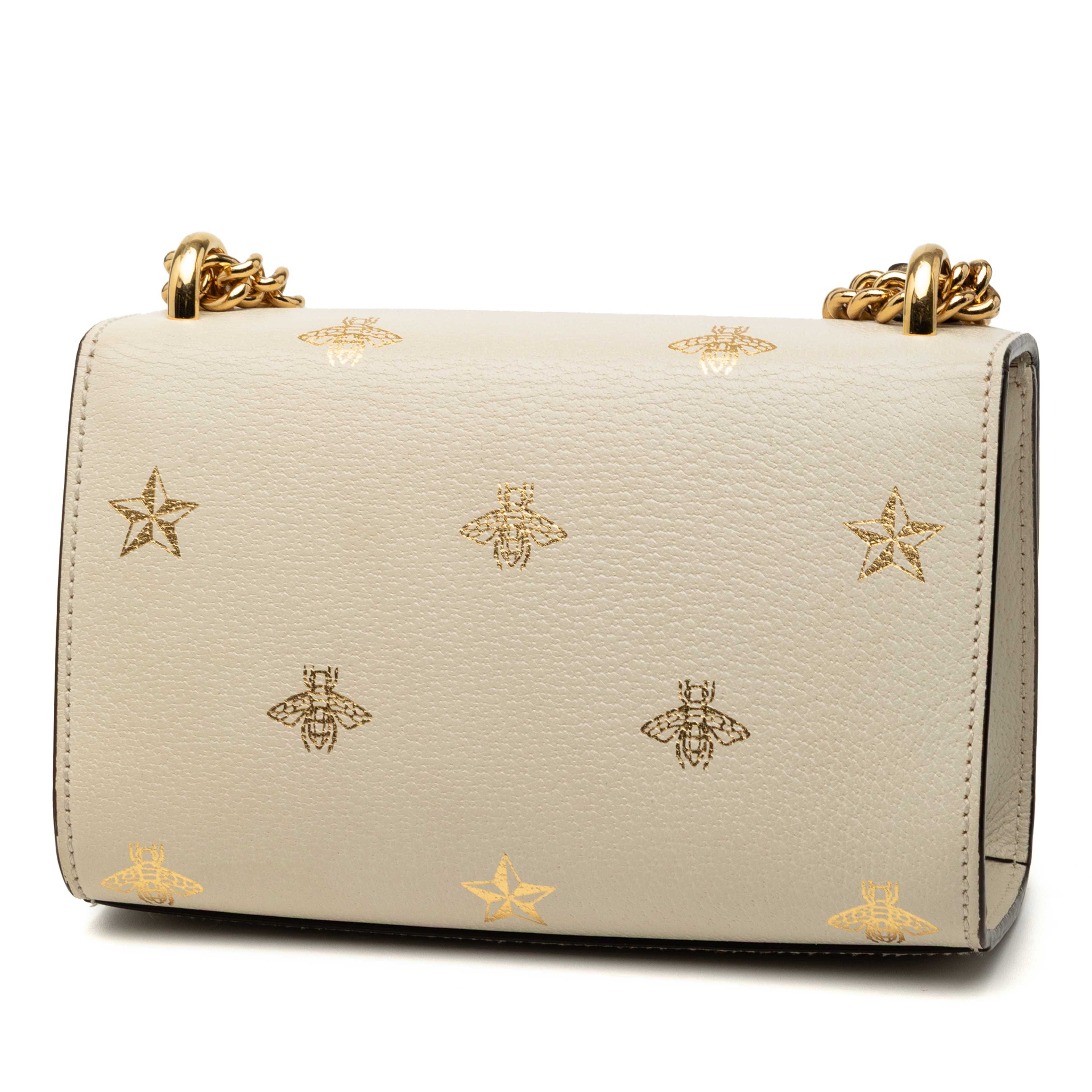 Gucci Small Leather Bee Star Padlock Crossbody, från Luxclusif, i färgen white. Klicka för att öppna bilden i stort format