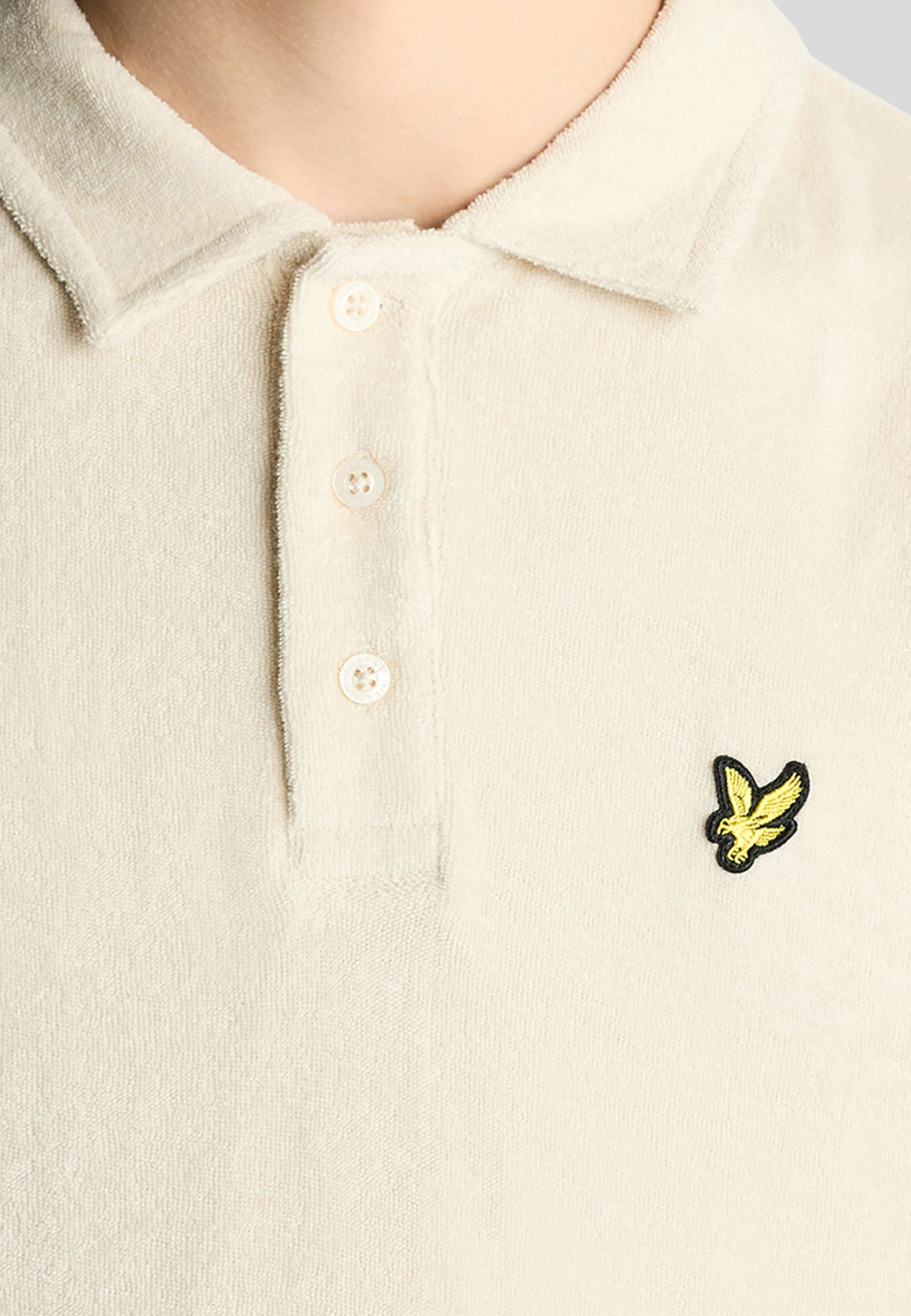 Pikétröja frotté, från Lyle & Scott, i färgen Cove. Klicka för att öppna bilden i stort format