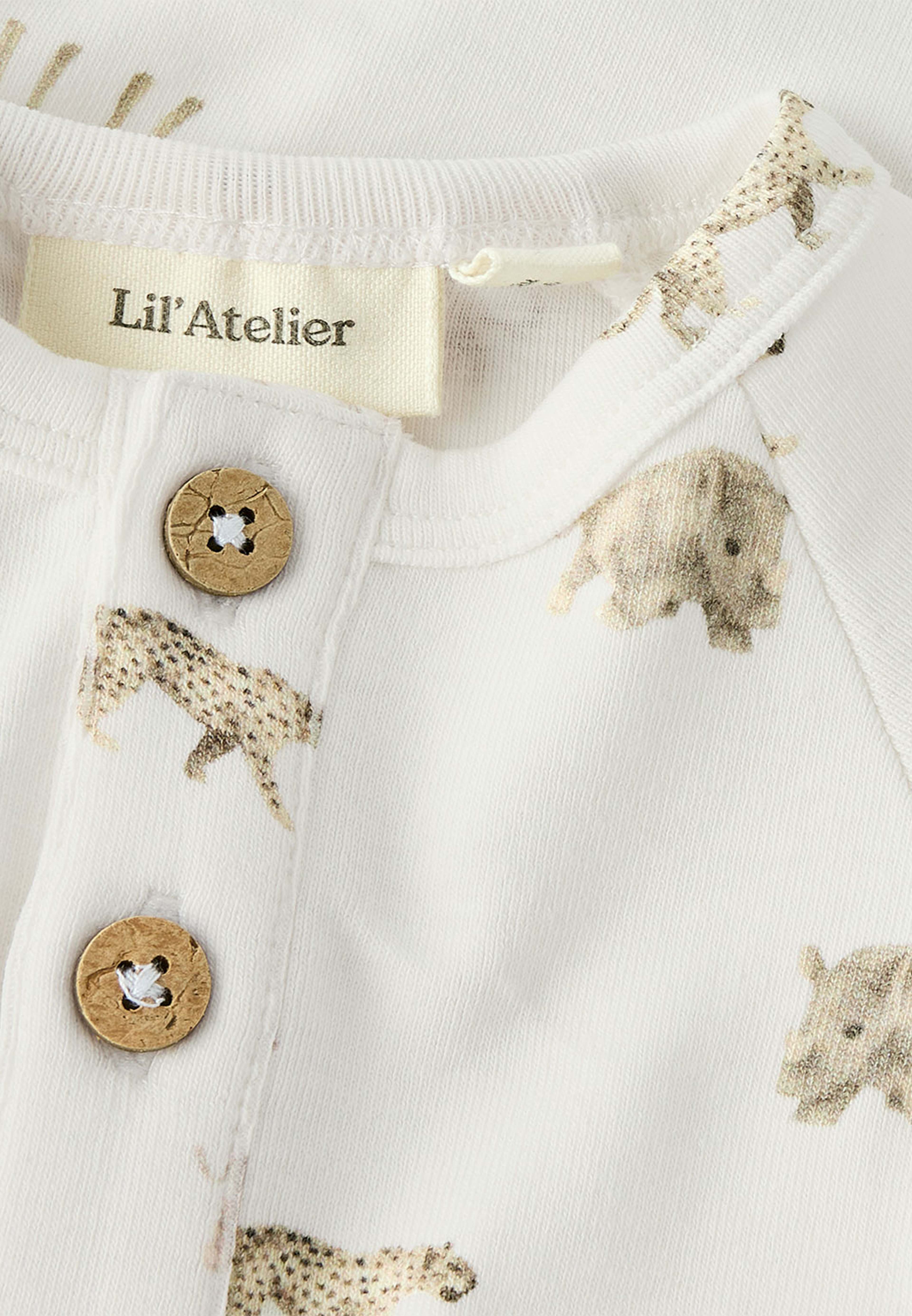 Gayo body, från Lil'Atelier, i färgen Coconut Milk Animals African. Klicka för att öppna bilden i stort format