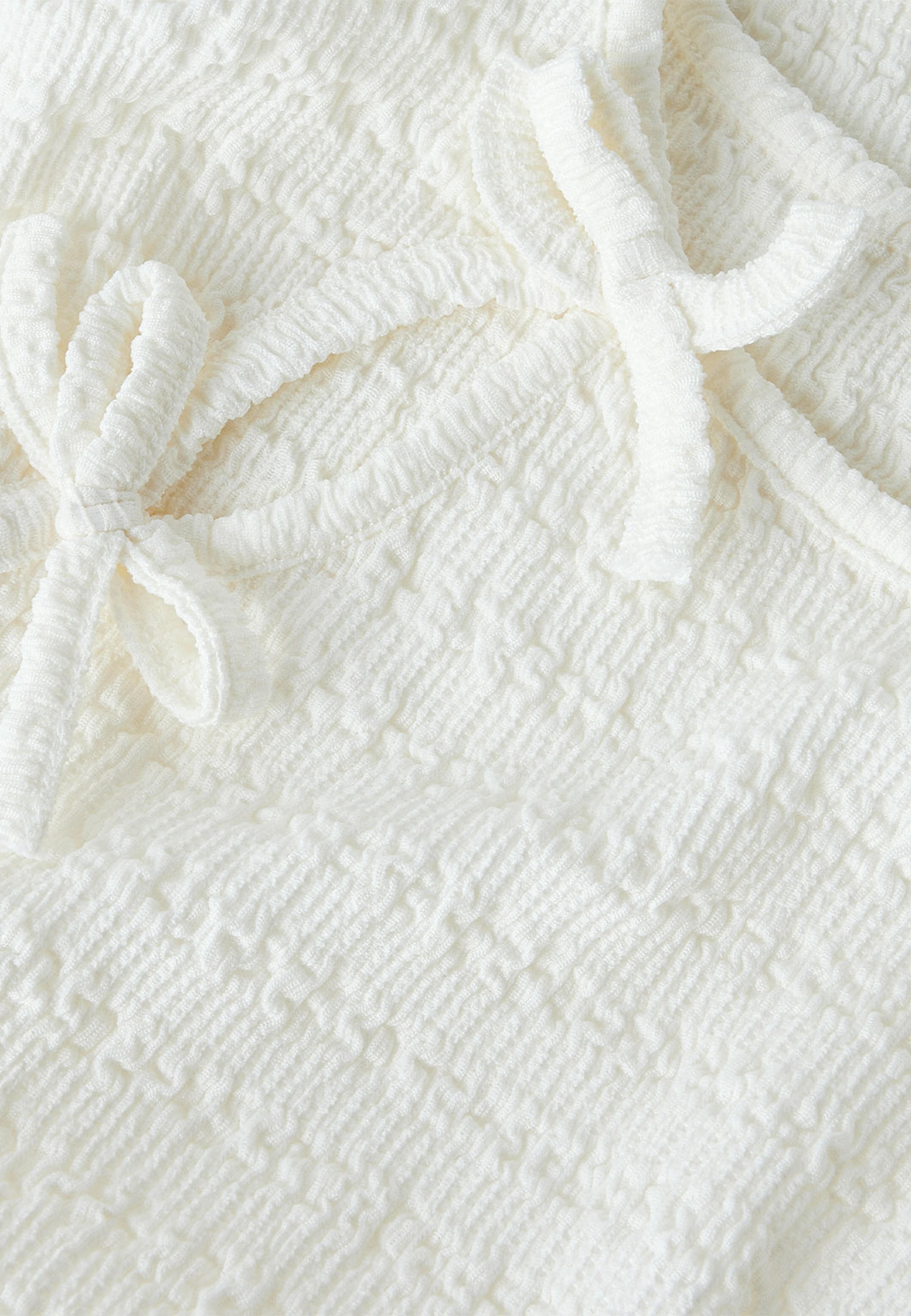 NKFBELINDO LS TOP, från Name It, i färgen Cloud Dancer. Klicka för att öppna bilden i stort format