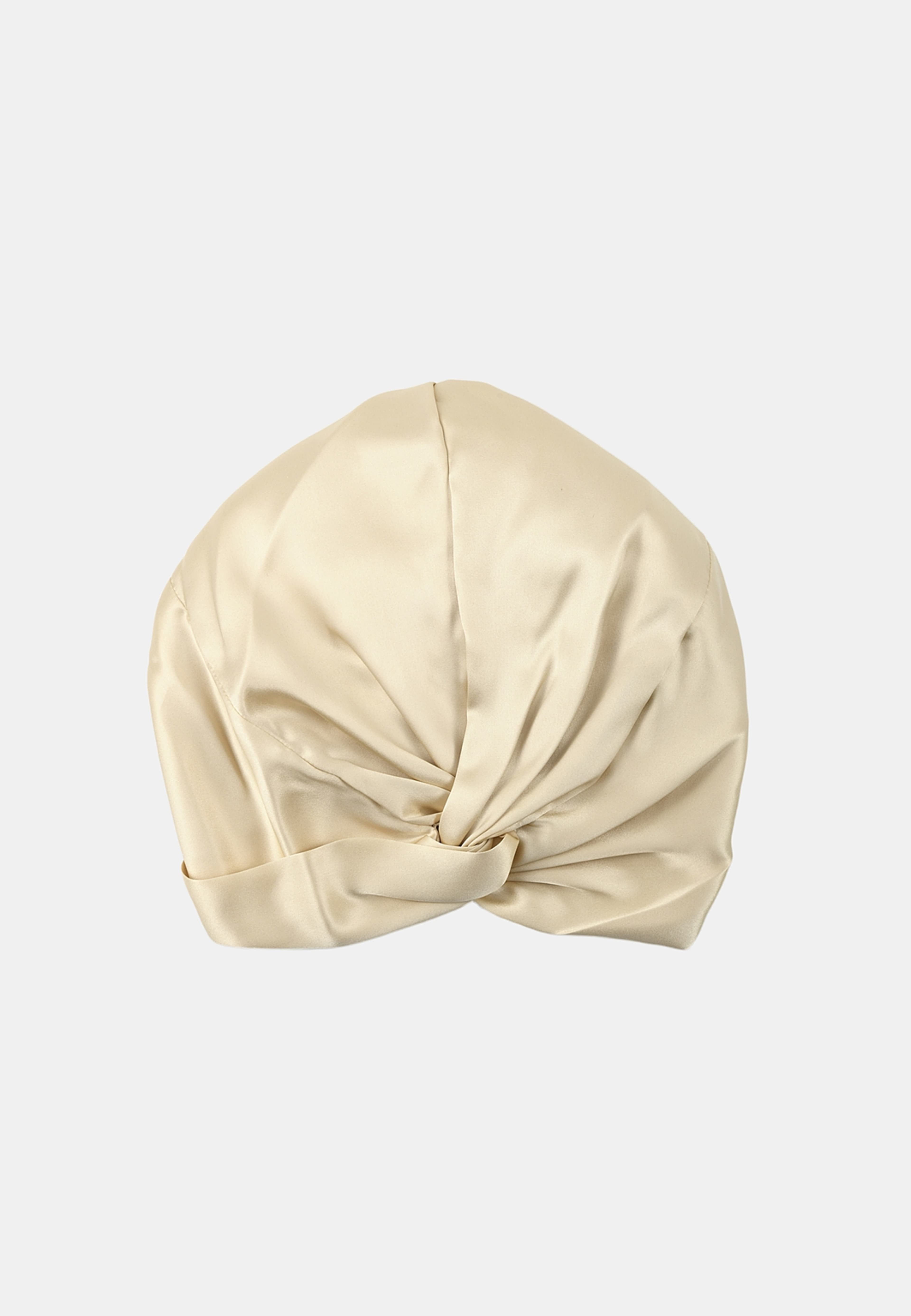 Silk Bonnet, från Å BEAUTY, i färgen Champagne. Klicka för att öppna bilden i stort format