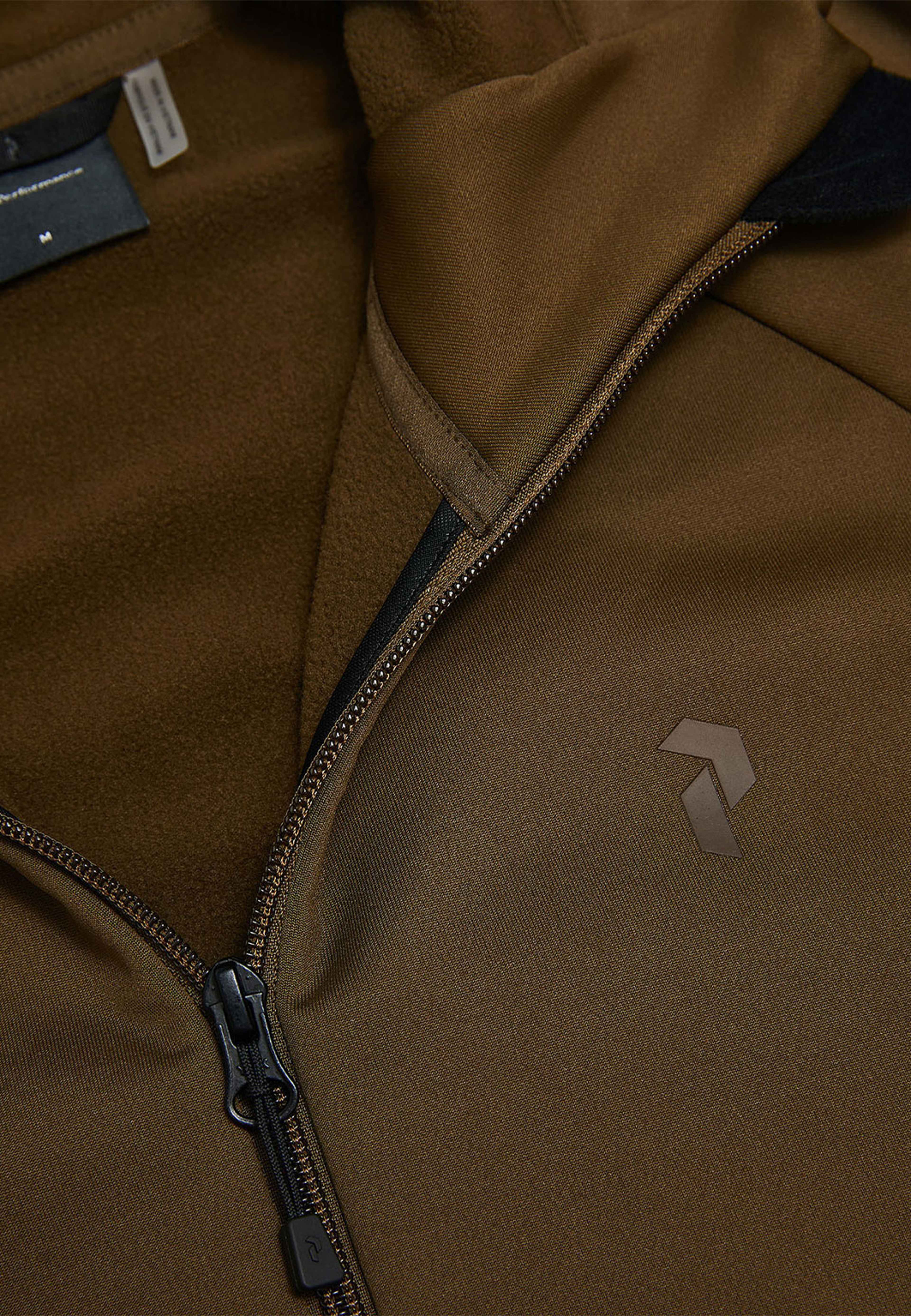 Rider Essentials Zip Hood, från Peak Performance, i färgen Meadow Moss. Klicka för att öppna bilden i stort format