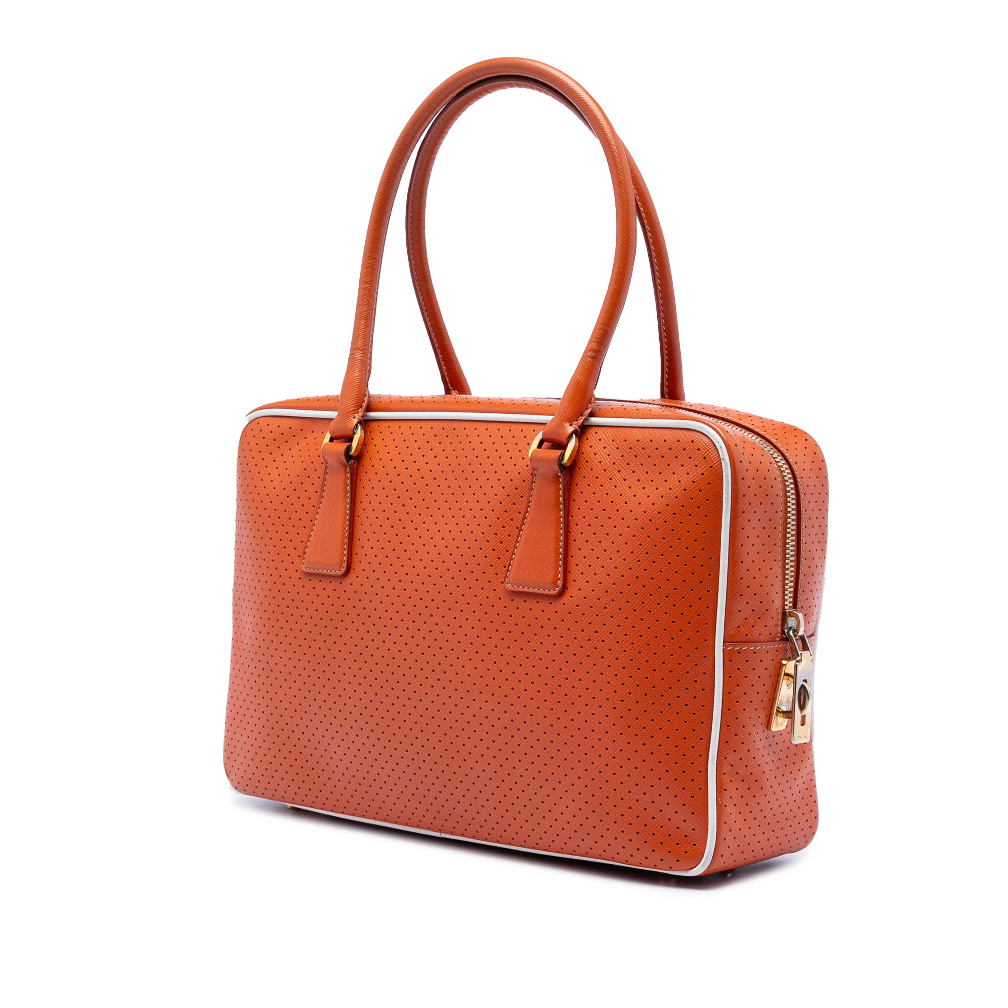 Prada Perforated Vitello Drive Leather Bauletto Top Handle Bag, från Luxclusif, i färgen dark orange. Klicka för att öppna bilden i stort format