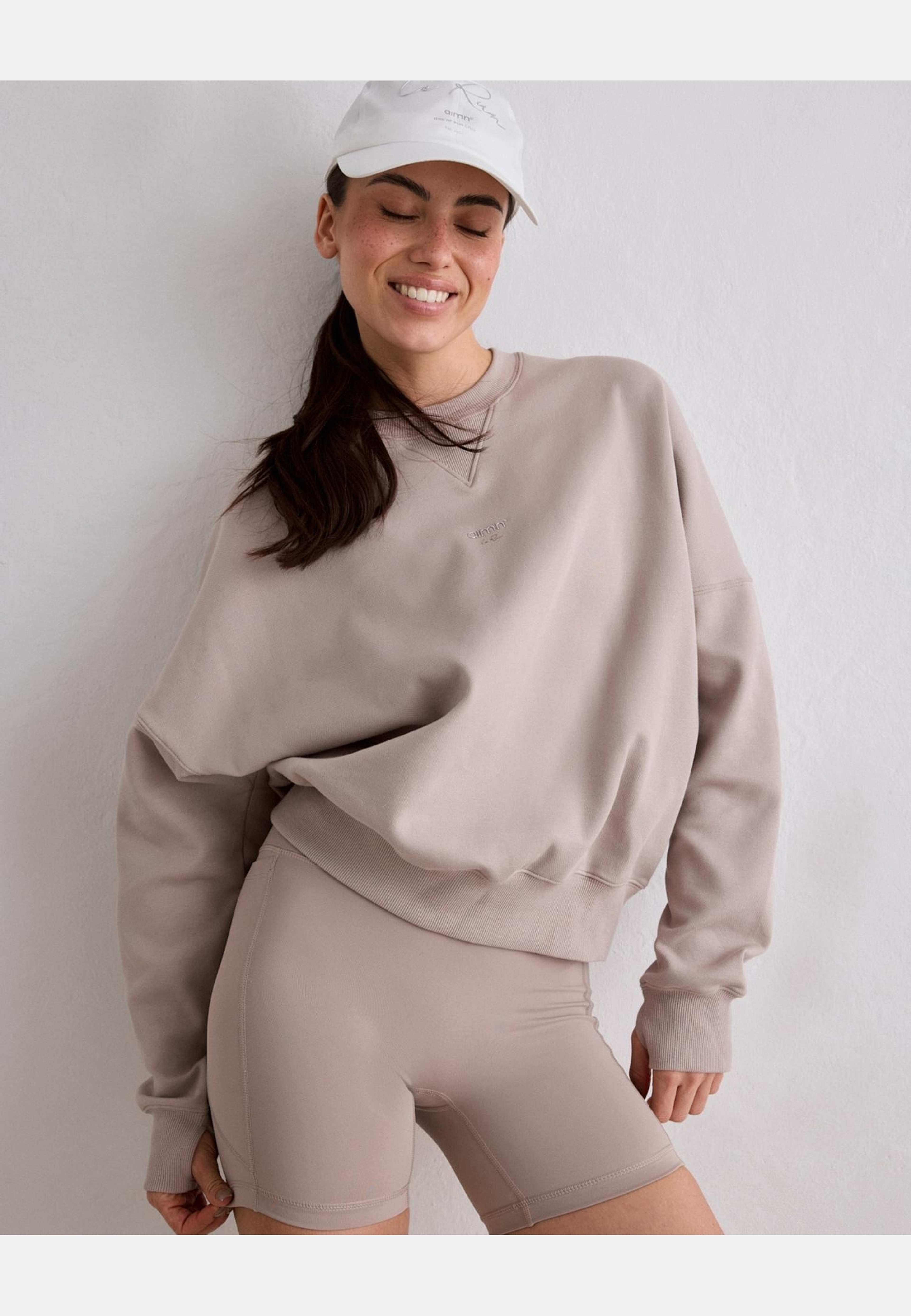 Le Run Running Sweatshirt, från aim'n, i färgen dark clay. Klicka för att öppna bilden i stort format