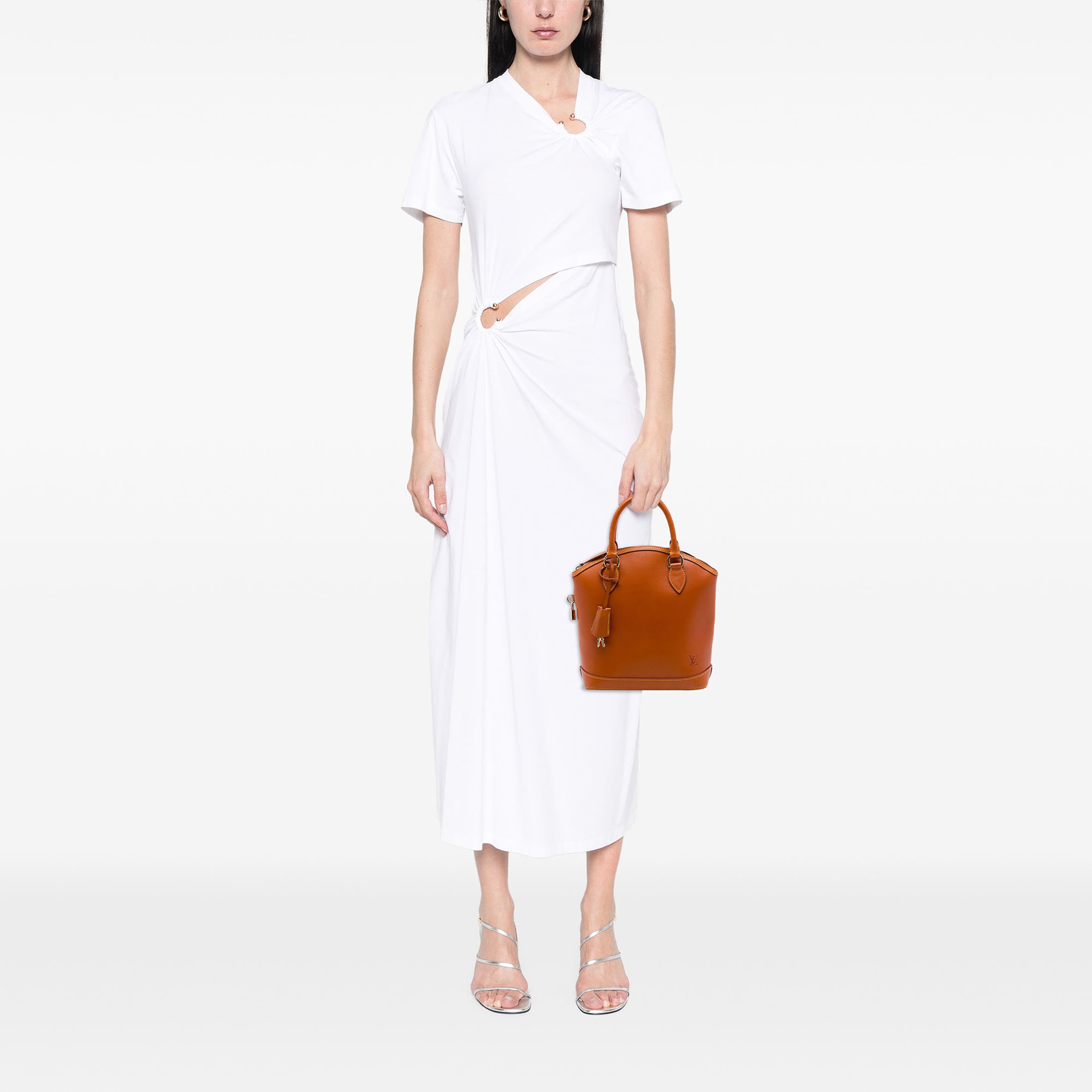 Louis Vuitton Nomade Lockit Vertical, från Luxclusif, i färgen brun. Klicka för att öppna bilden i stort format