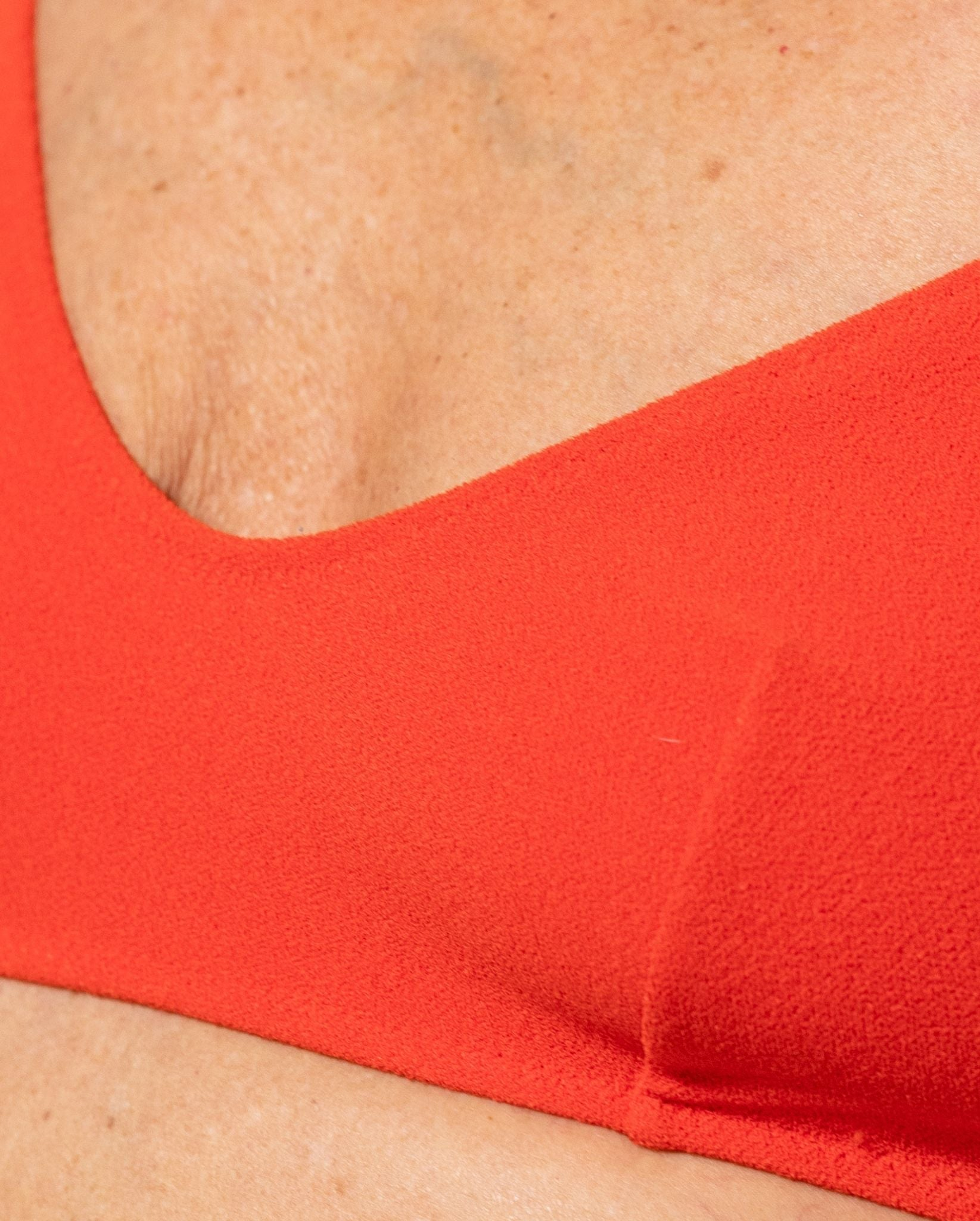 Strappy Scoop Bikini Top, från Understatement, i färgen papaya. Klicka för att öppna bilden i stort format