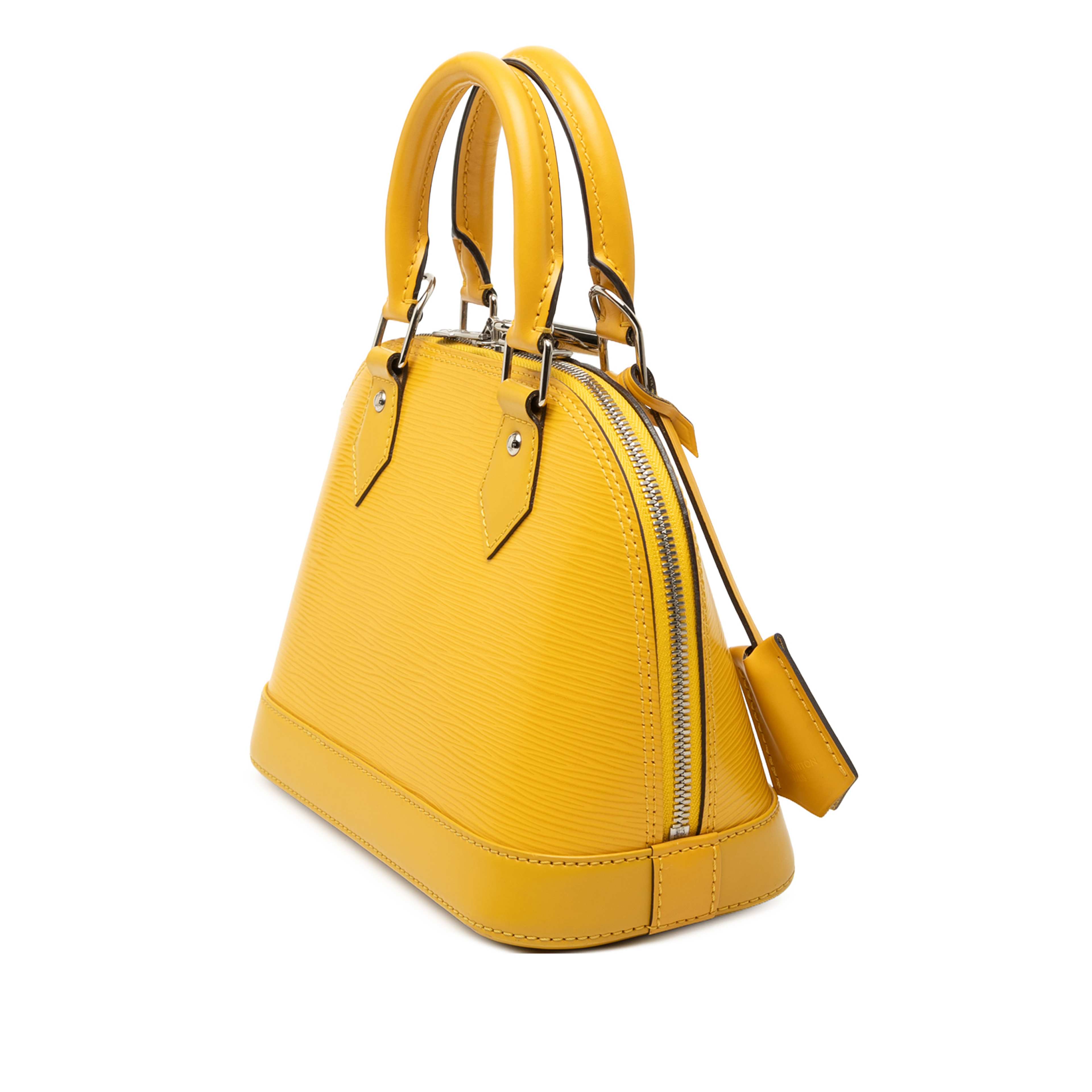 Louis Vuitton Epi Alma Bb, från Luxclusif, i färgen yellow. Klicka för att öppna bilden i stort format
