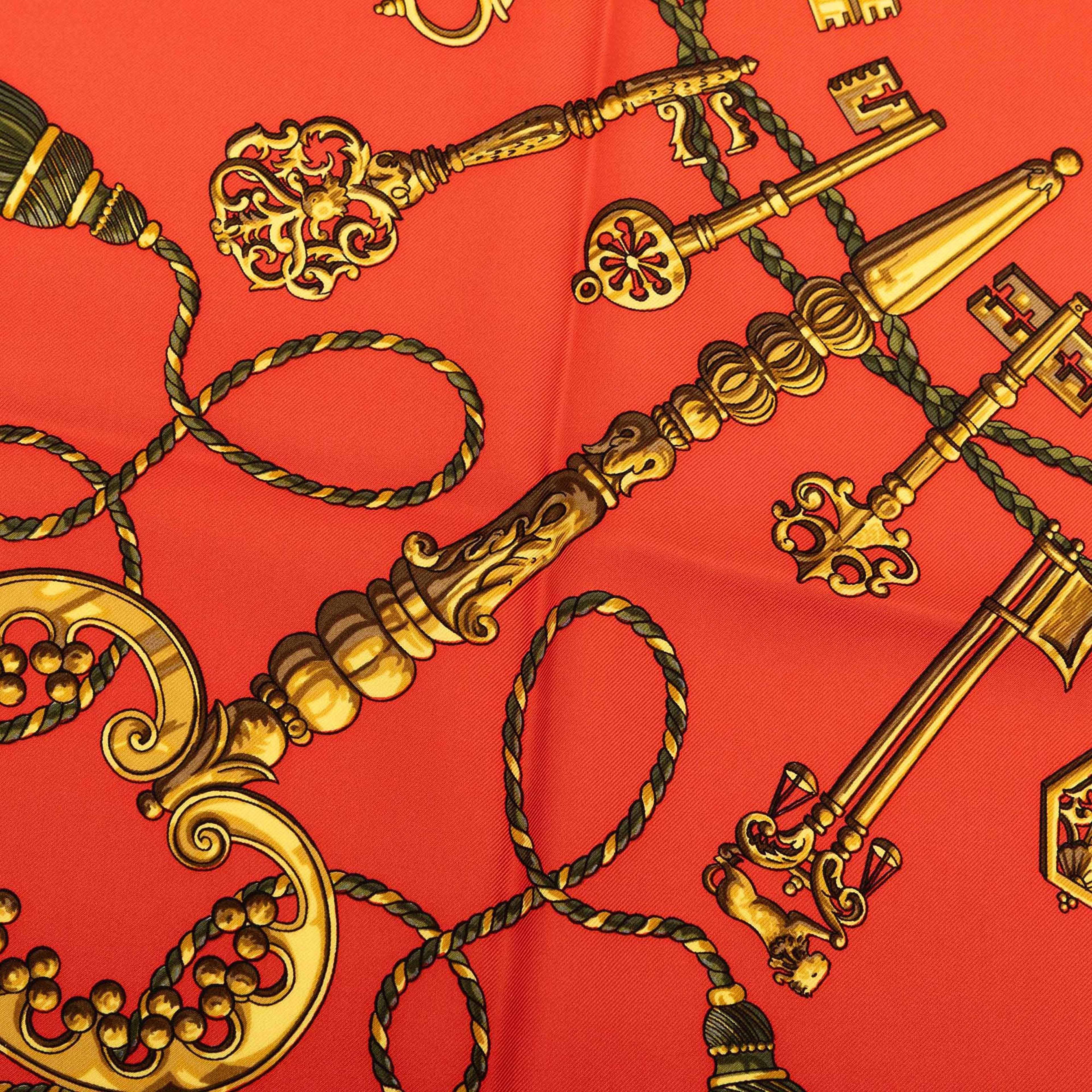 Hermès Les Cles Silk Scarf 90, från Luxclusif, i färgen dark orange. Klicka för att öppna bilden i stort format
