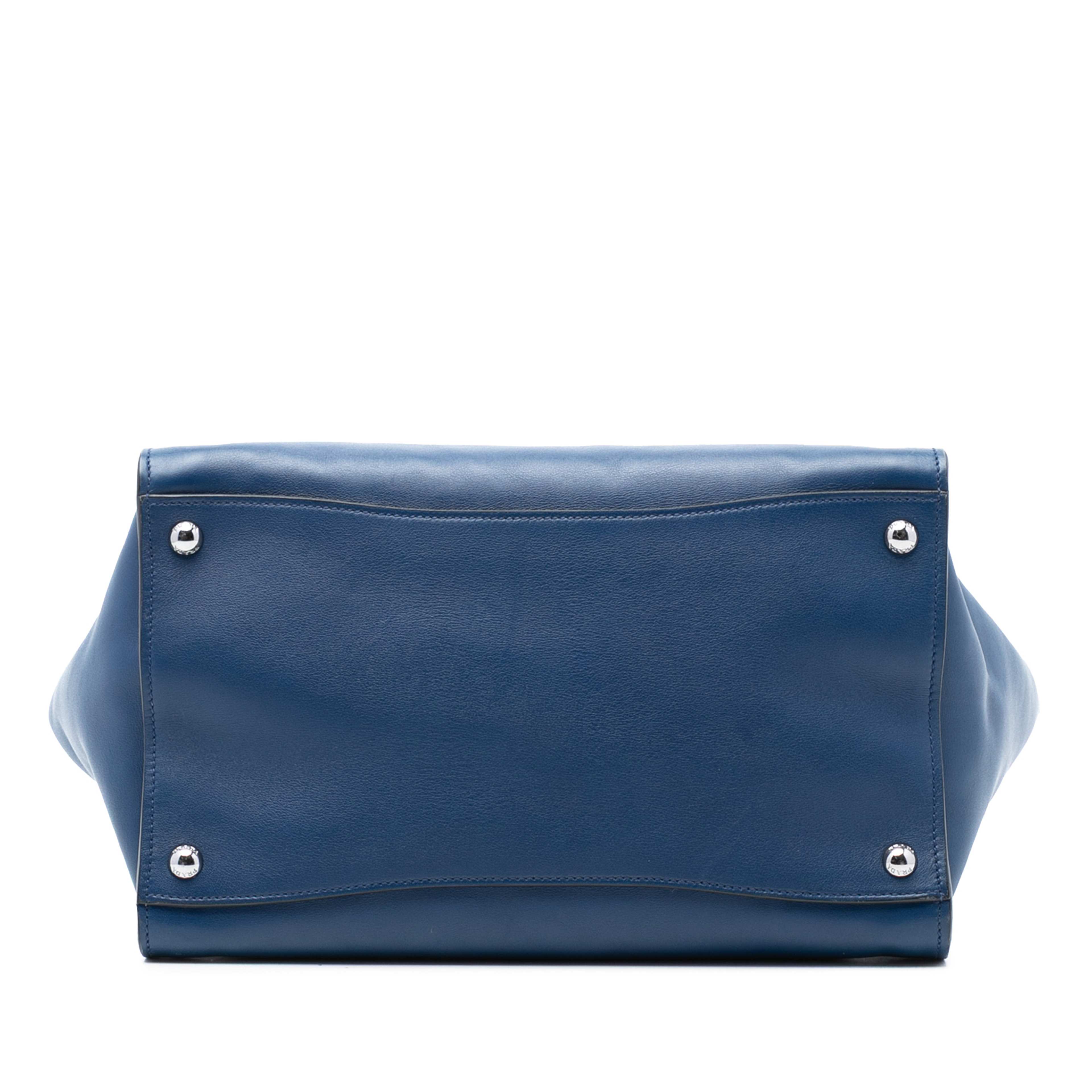 Prada Glace Calf Twin Pocket Double Handle Satchel, från Luxclusif, i färgen blue. Klicka för att öppna bilden i stort format