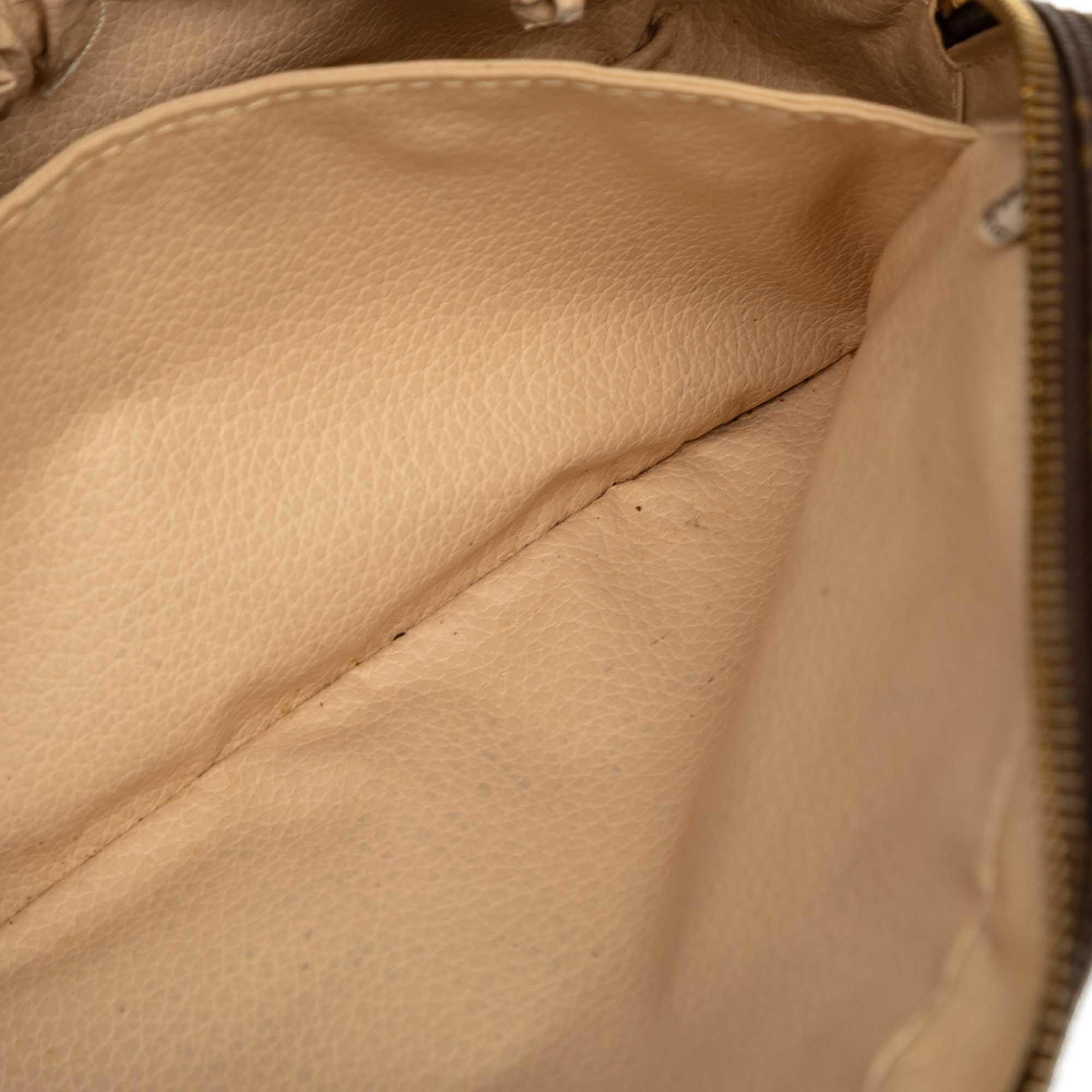 Louis Vuitton Monogram Trousse Toilette 23, från Luxclusif, i färgen brun. Klicka för att öppna bilden i stort format