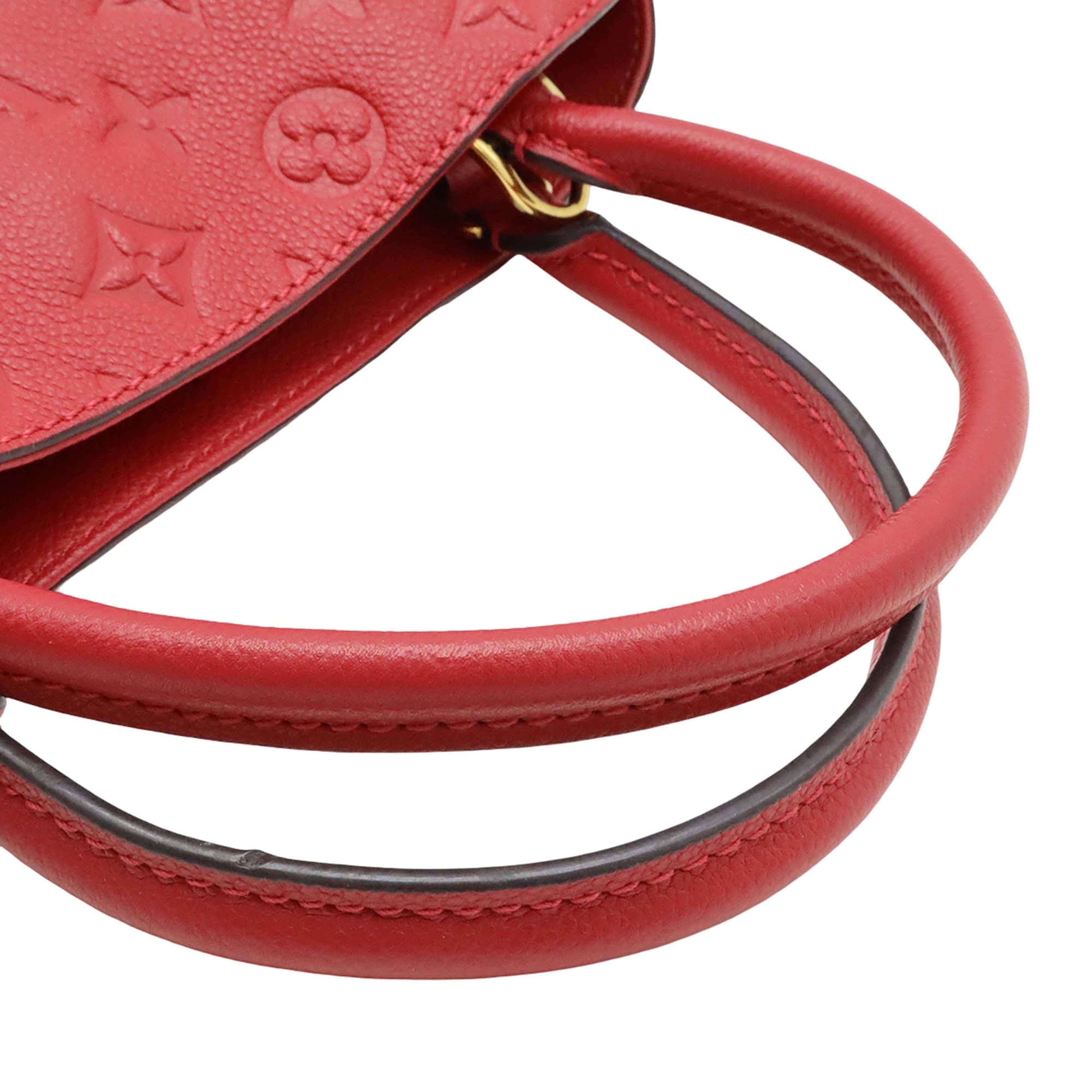 Louis Vuitton Monogram Empreinte Montaigne Mm, från Luxclusif, i färgen röd. Klicka för att öppna bilden i stort format