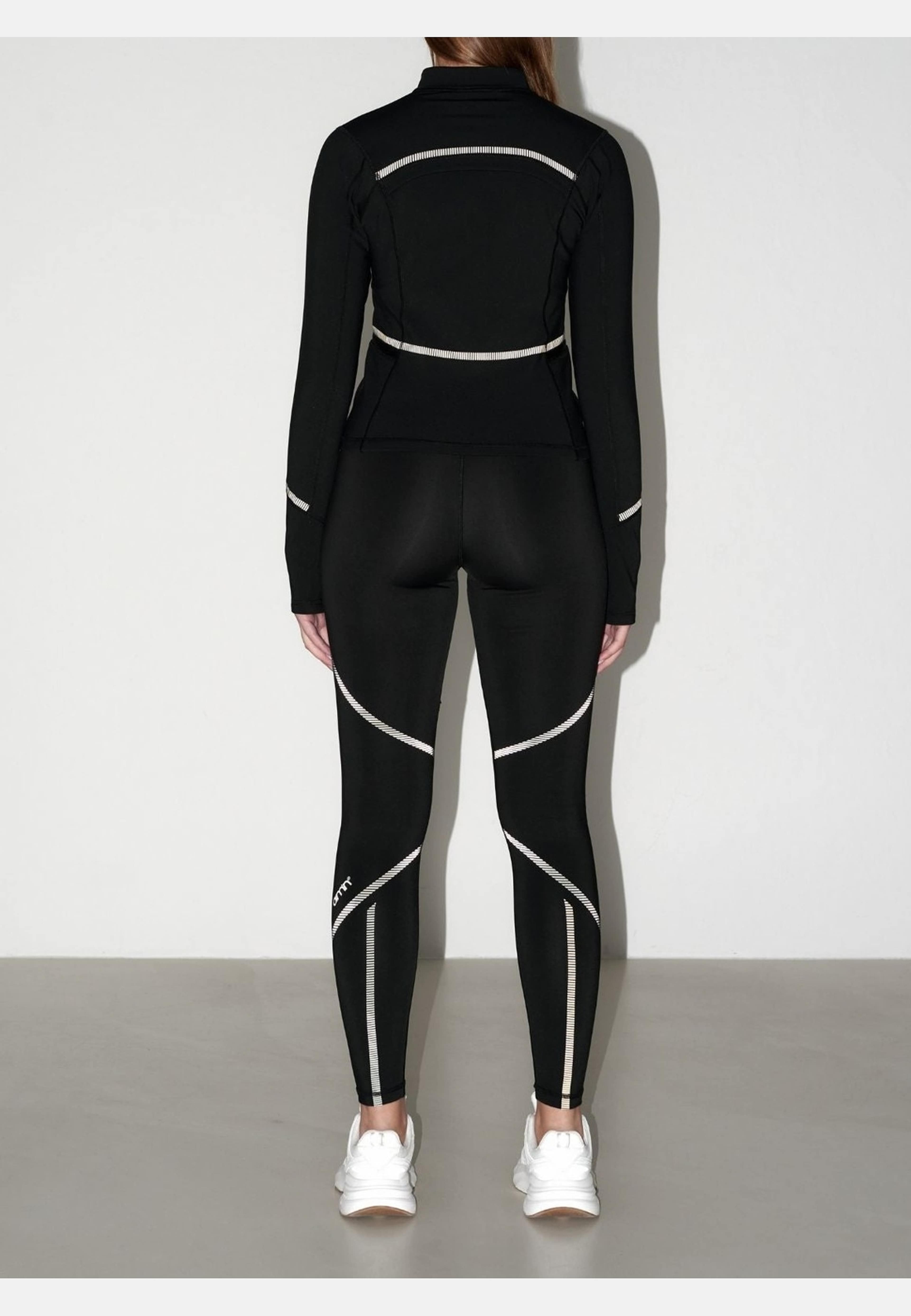 Reflective Warming Zip Jacket, från aim'n, i färgen black. Klicka för att öppna bilden i stort format