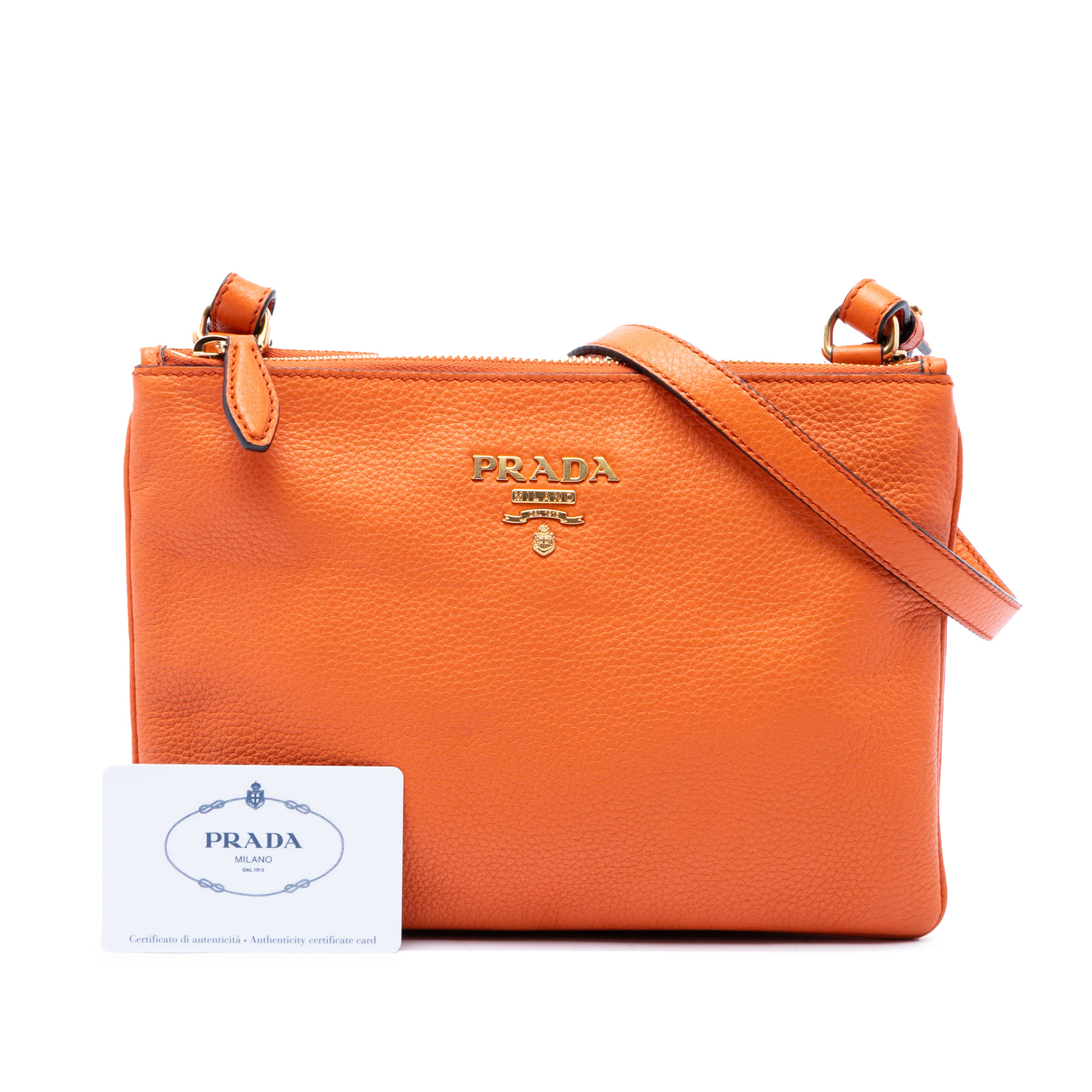 Prada Vitello Phenix Double Zip Crossbody, från Luxclusif, i färgen orange. Klicka för att öppna bilden i stort format