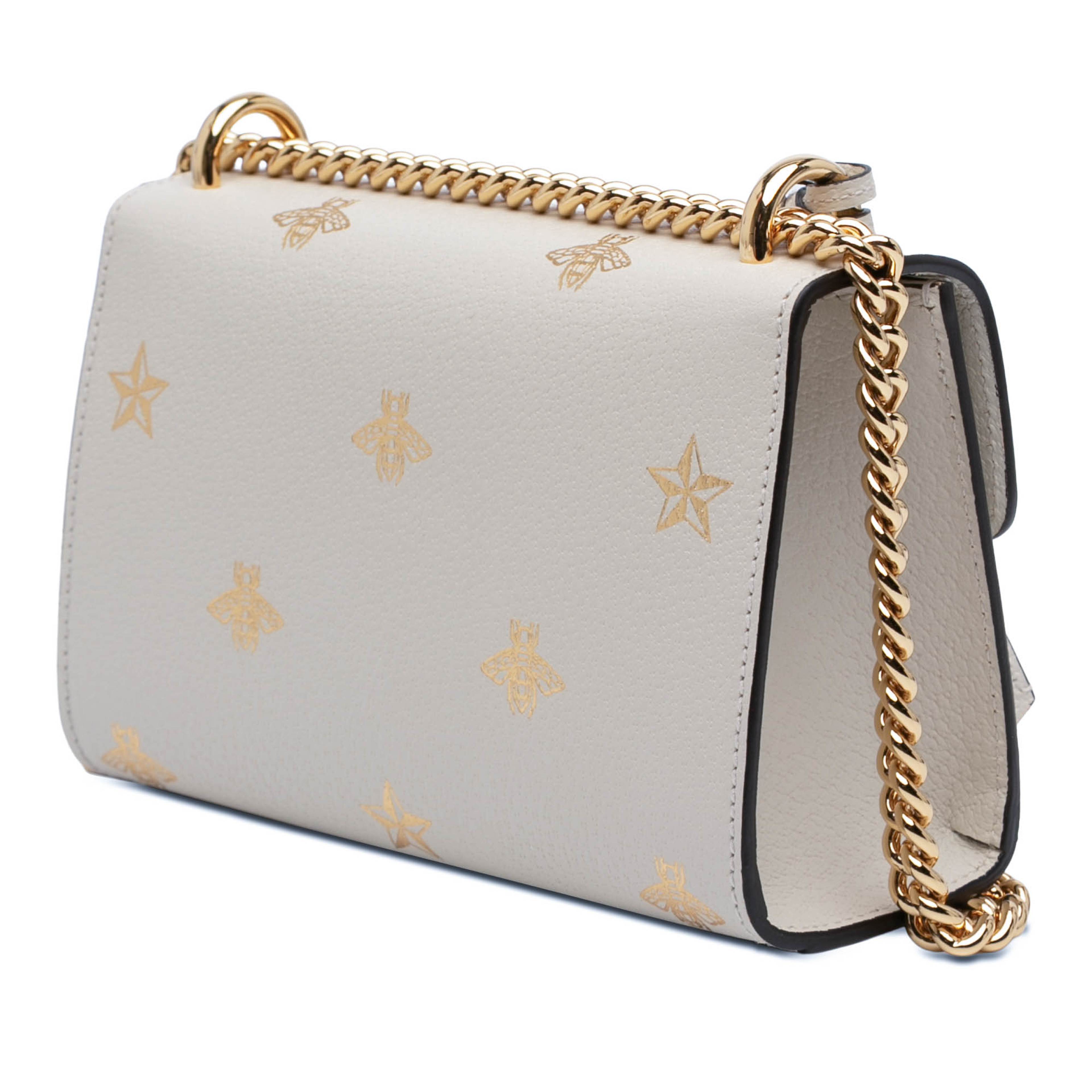 Gucci Small Leather Bee Star Padlock Crossbody, från Luxclusif, i färgen vit. Klicka för att öppna bilden i stort format