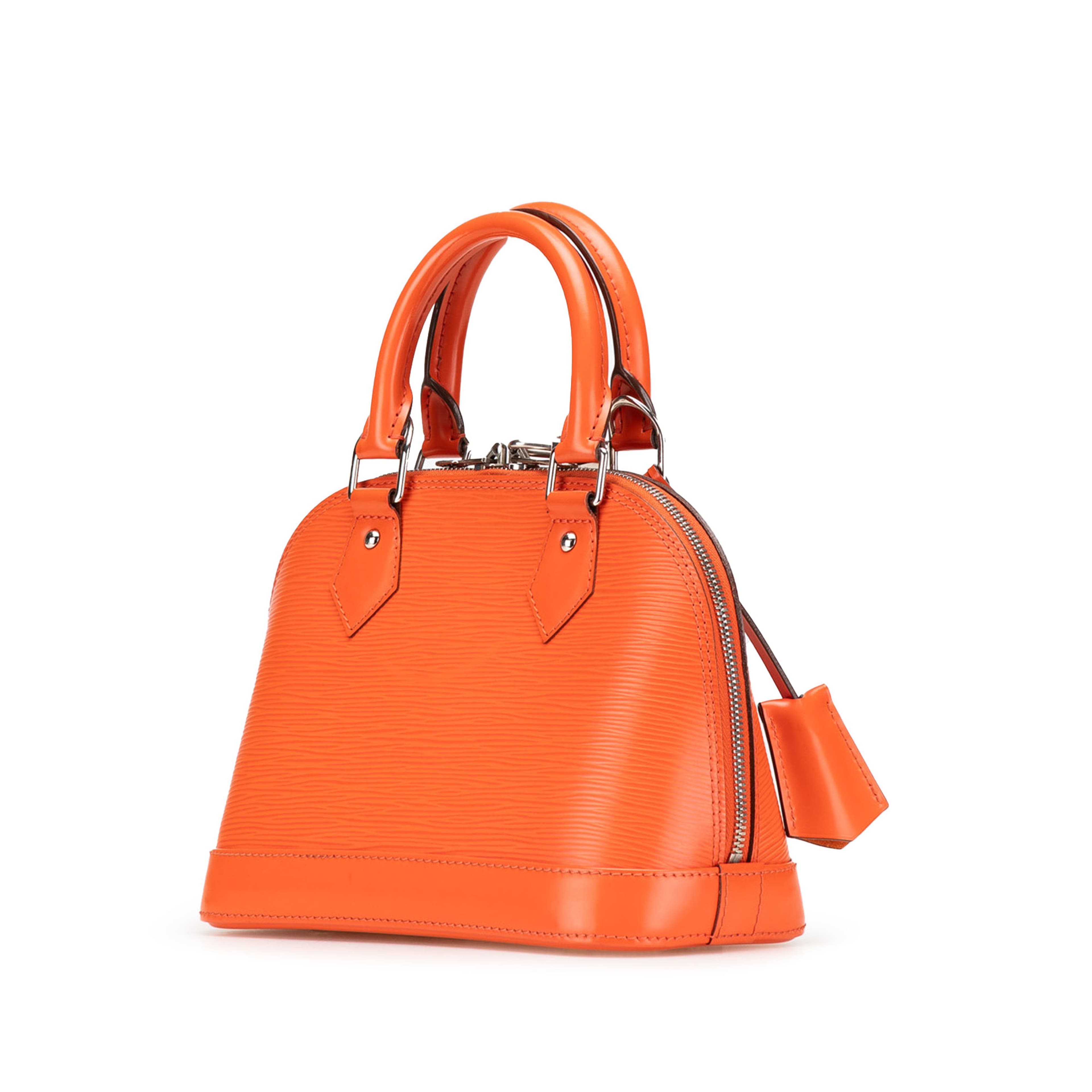 Louis Vuitton Epi Alma Bb, från Luxclusif, i färgen dark orange. Klicka för att öppna bilden i stort format