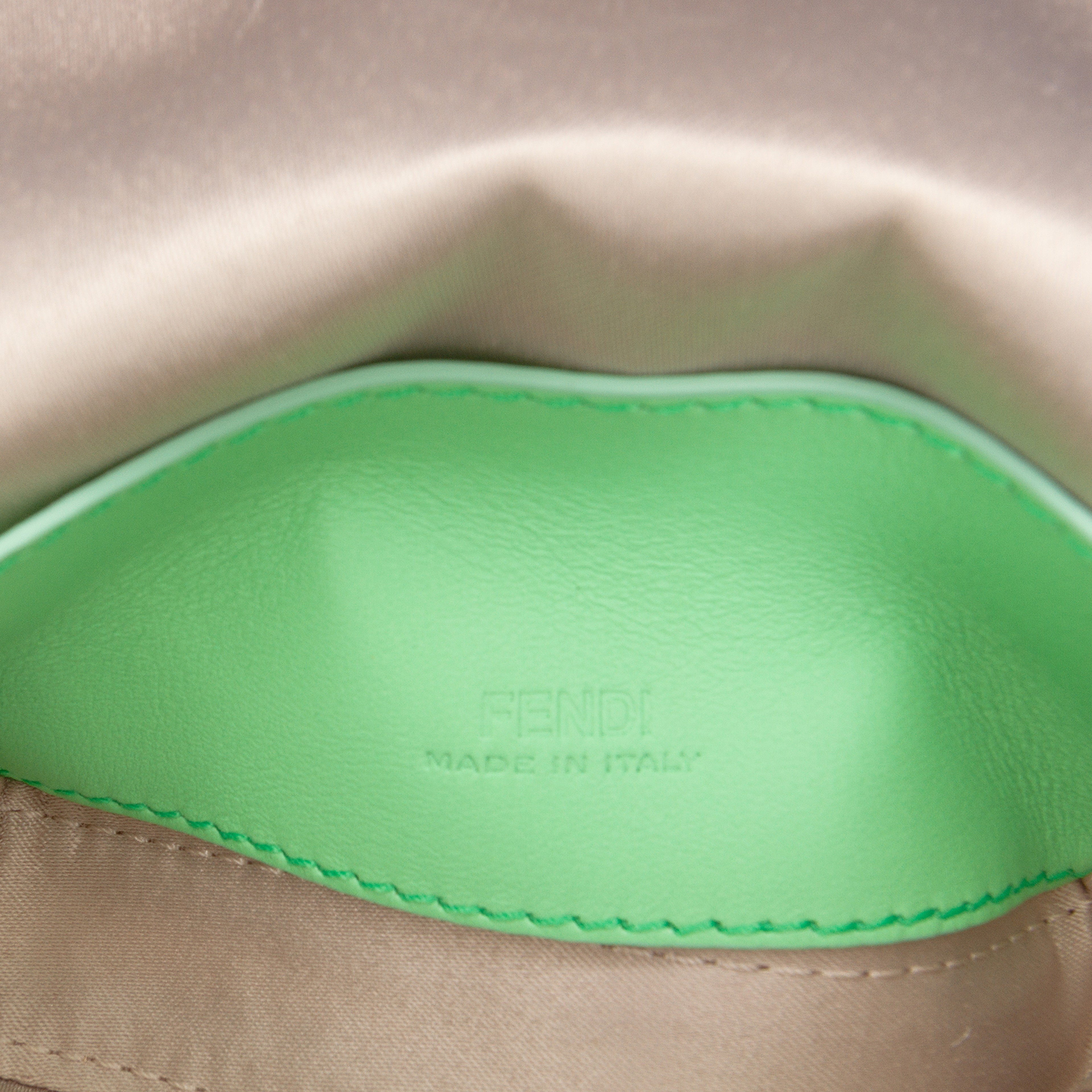 Fendi Nano Satin Charm Baguette, från Luxclusif, i färgen beige. Klicka för att öppna bilden i stort format