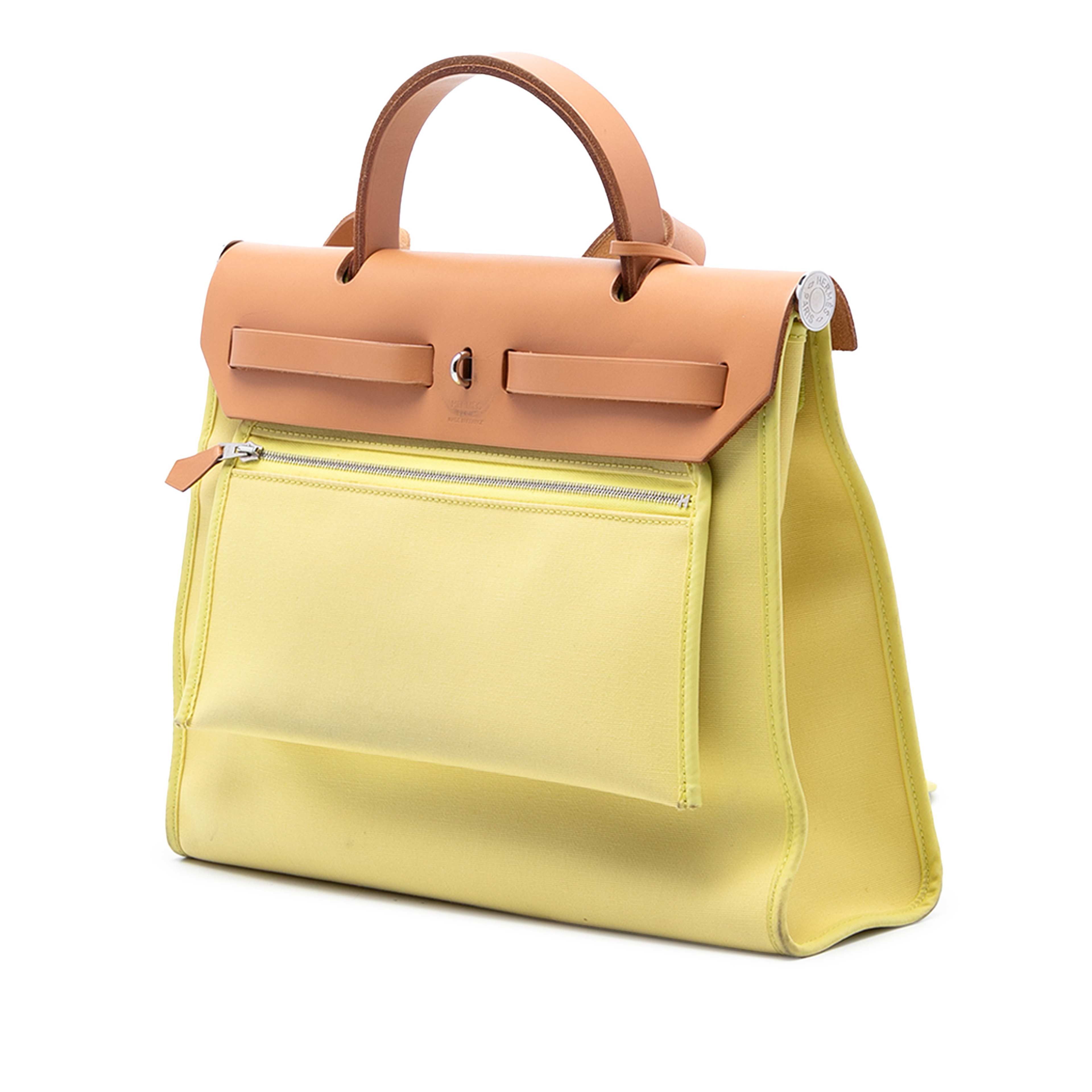 Hermès Toile Herbag Zip 31, från Luxclusif, i färgen brun. Klicka för att öppna bilden i stort format