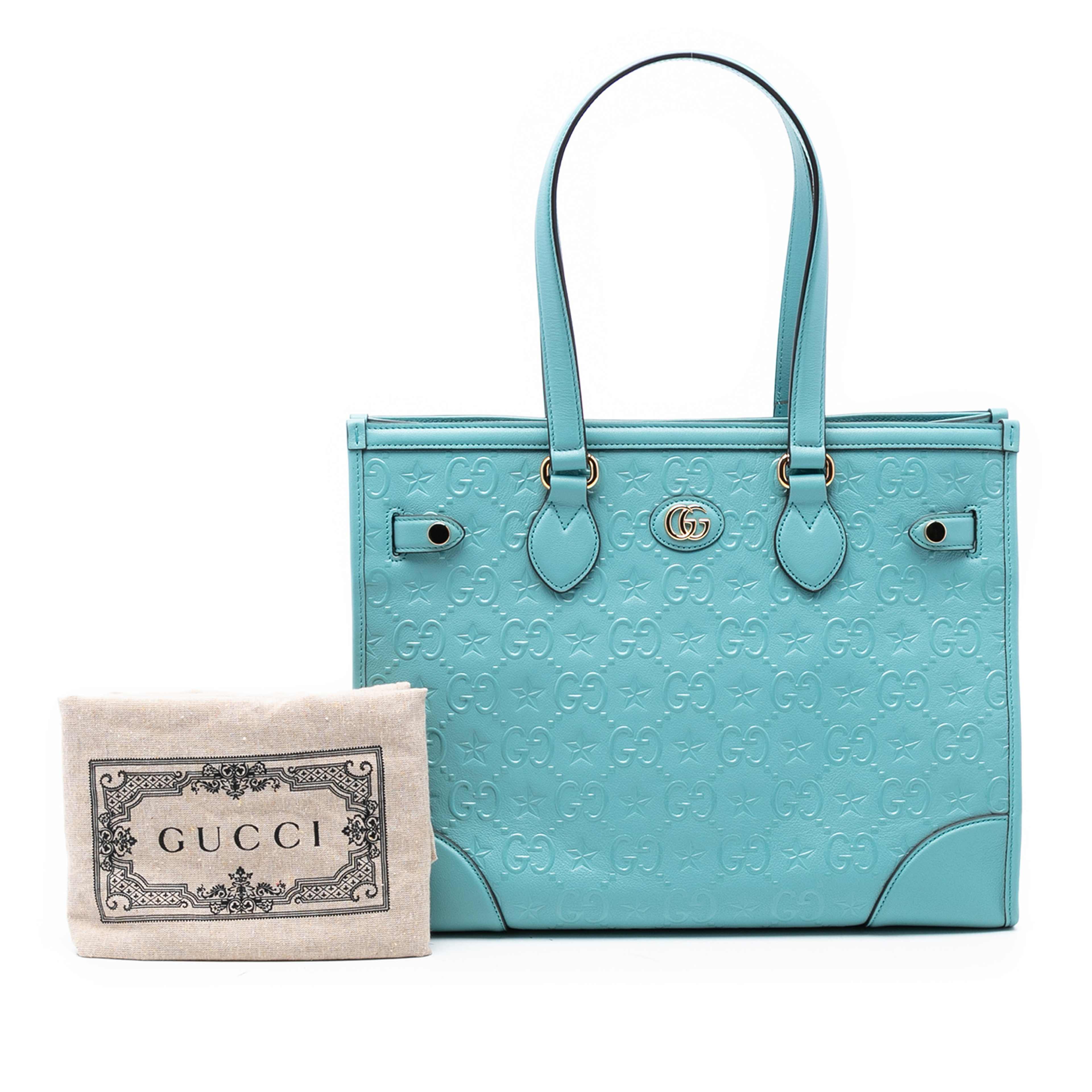 Gucci Gg Star Embossed Leather Tote, från Luxclusif, i färgen blå. Klicka för att öppna bilden i stort format