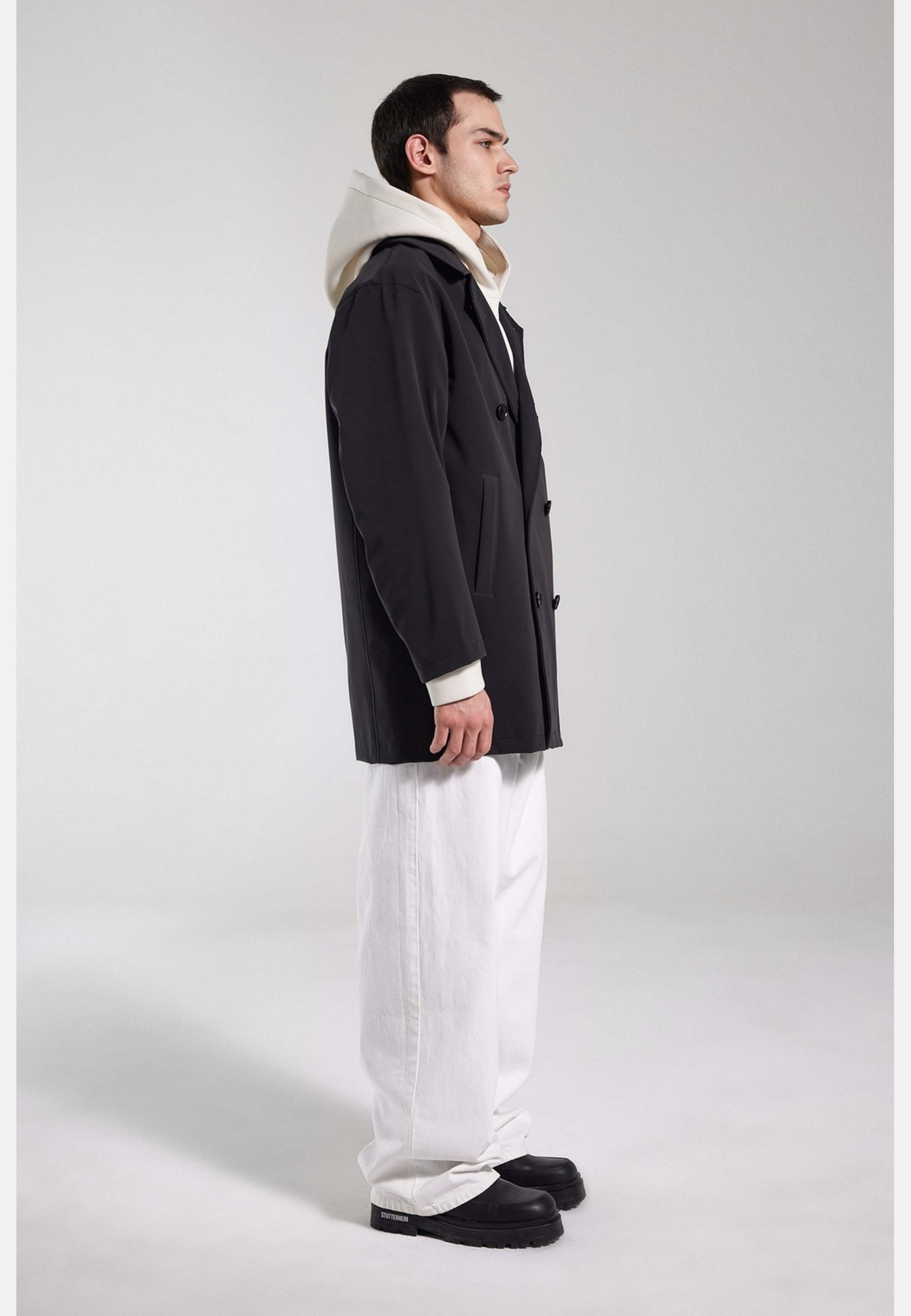 Åtvidaberg Raincoat, från Stutterheim, i färgen black. Klicka för att öppna bilden i stort format