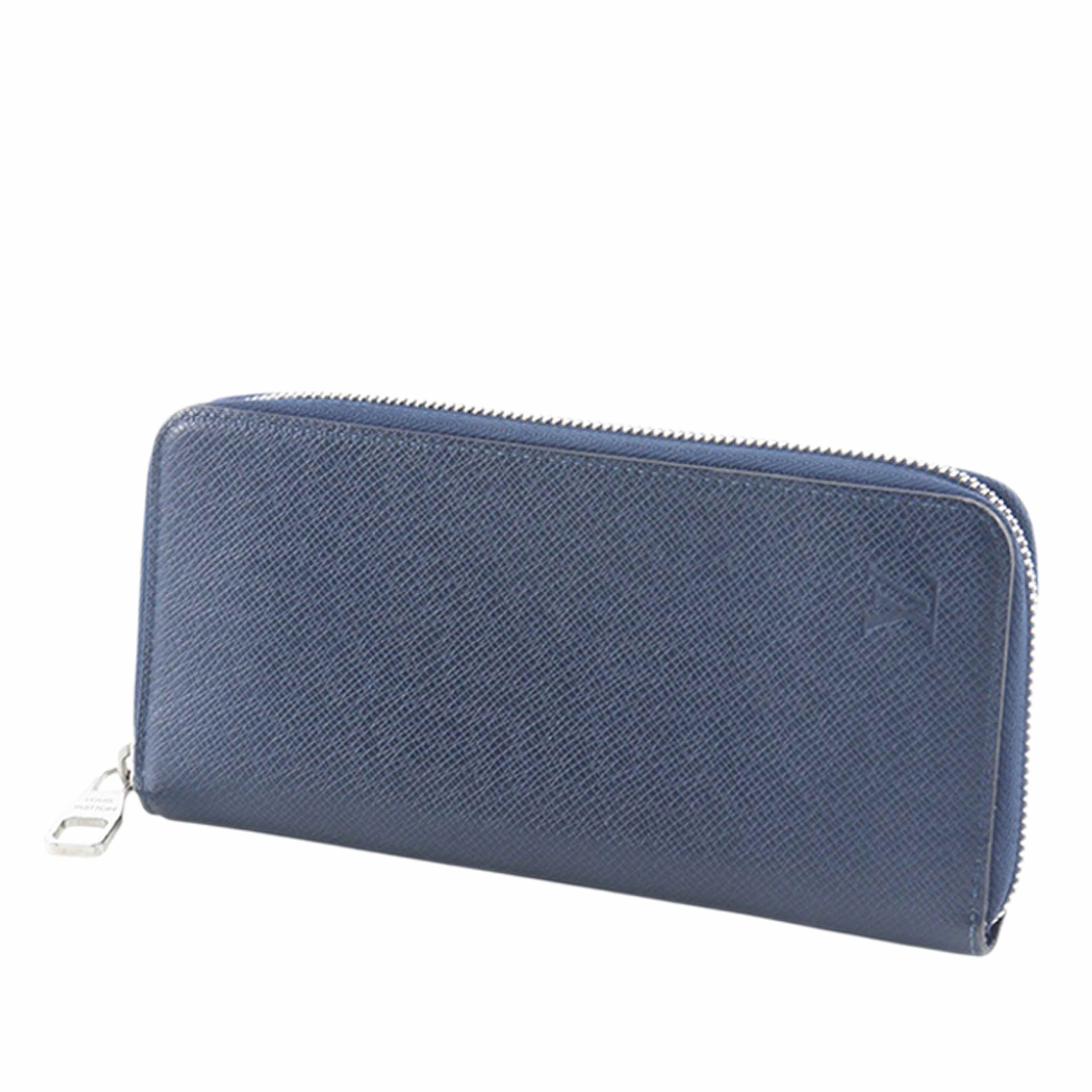Louis Vuitton Taiga Zippy Vertical Long Wallet, från Luxclusif, i färgen navy. Klicka för att öppna bilden i stort format