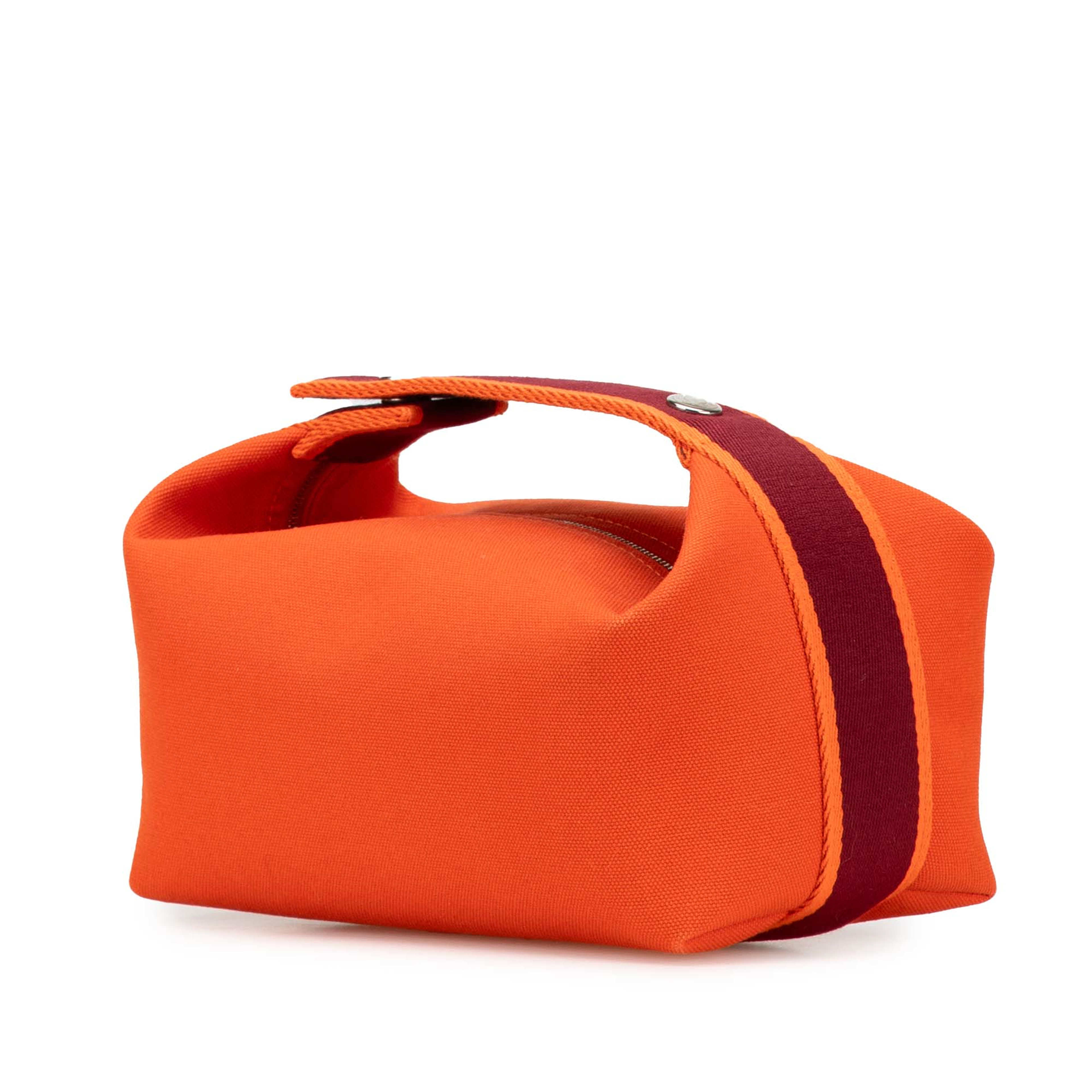 Hermès Small Toile Bride A Brac, från Luxclusif, i färgen dark orange.