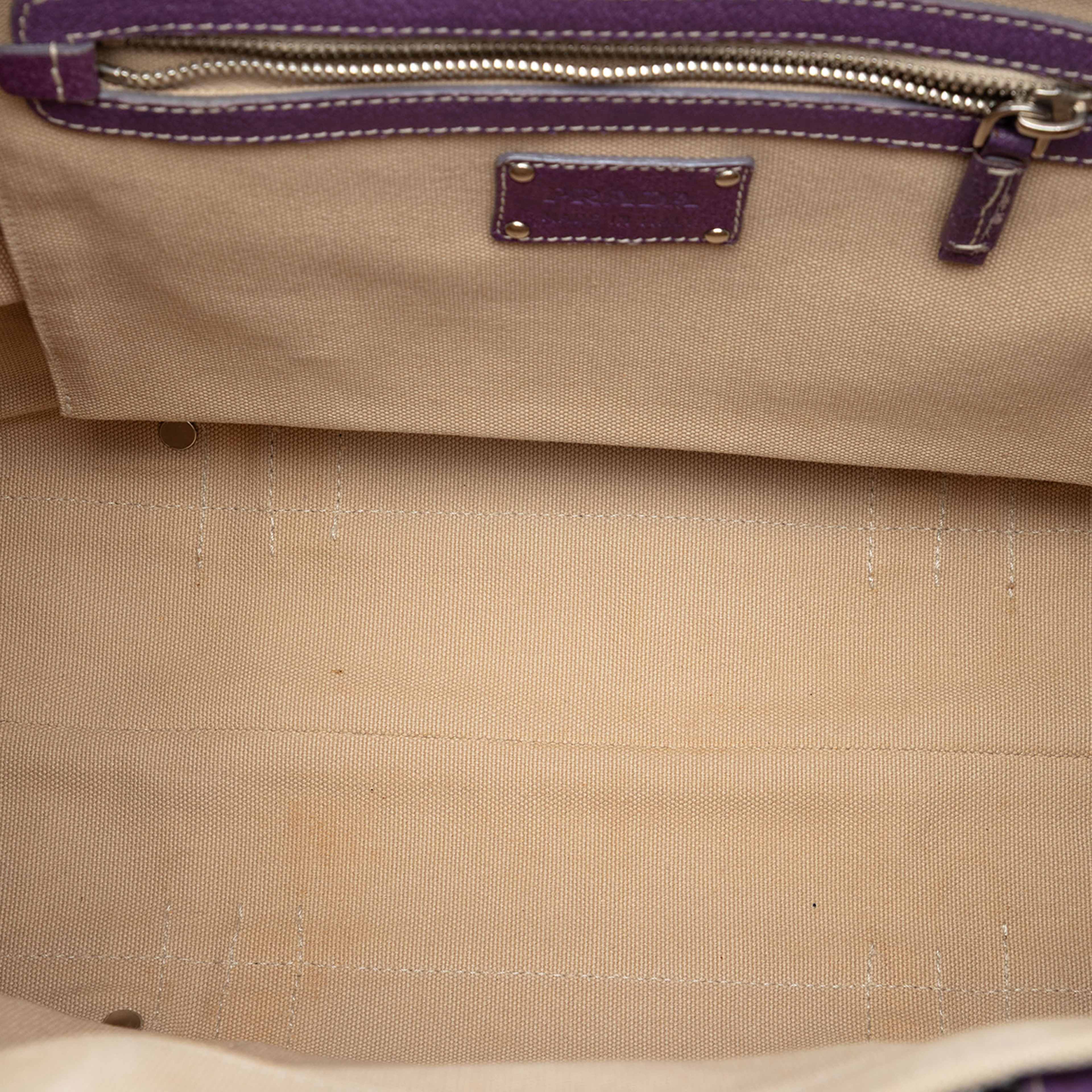Prada Studded Leather Trimmed Canvas Front Pocket Tote, från Luxclusif, i färgen light beige. Klicka för att öppna bilden i stort format