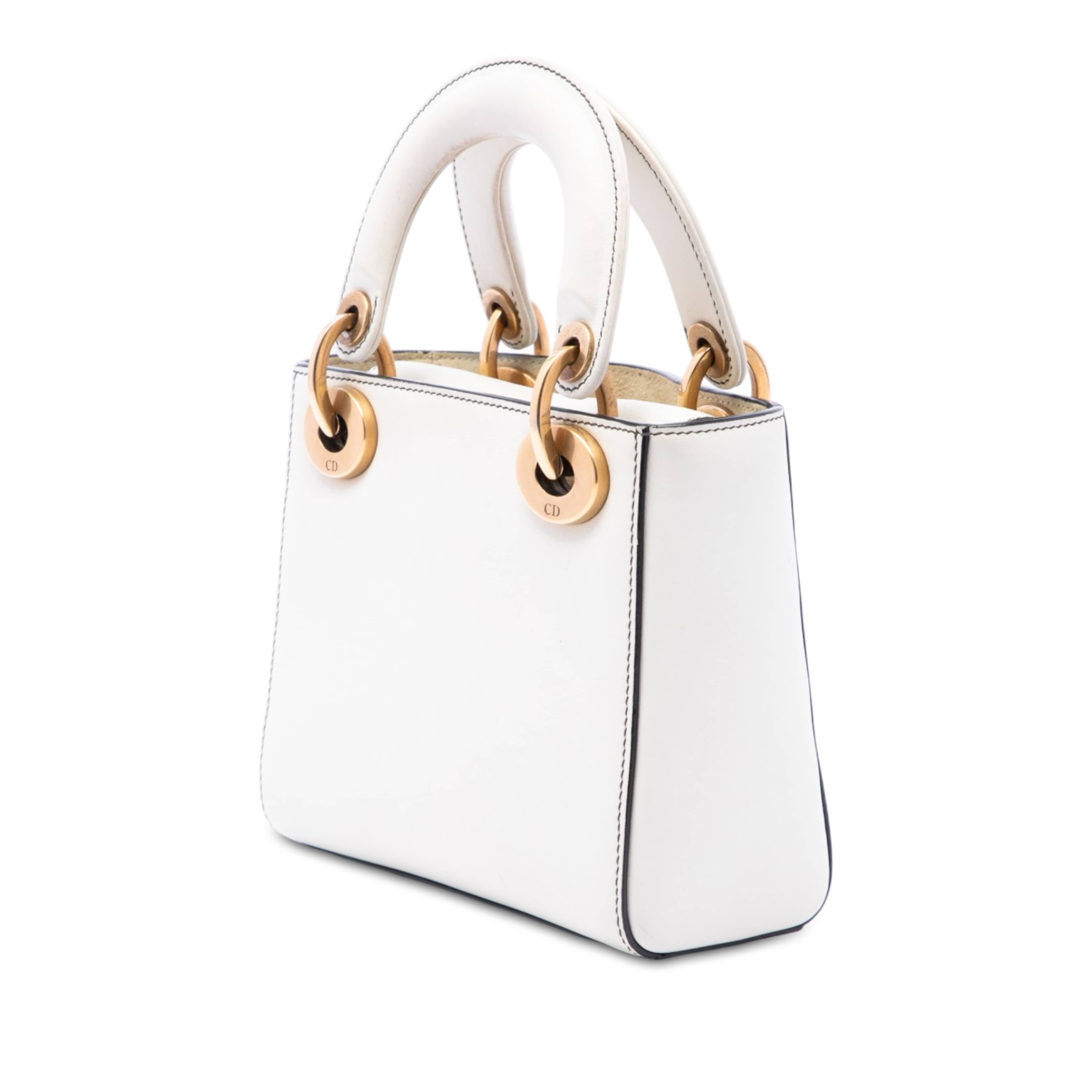 Dior Dioramour Niki De Saint Phalle Mini Calfskin Love Lady Dior, från Luxclusif, i färgen vit. Klicka för att öppna bilden i stort format