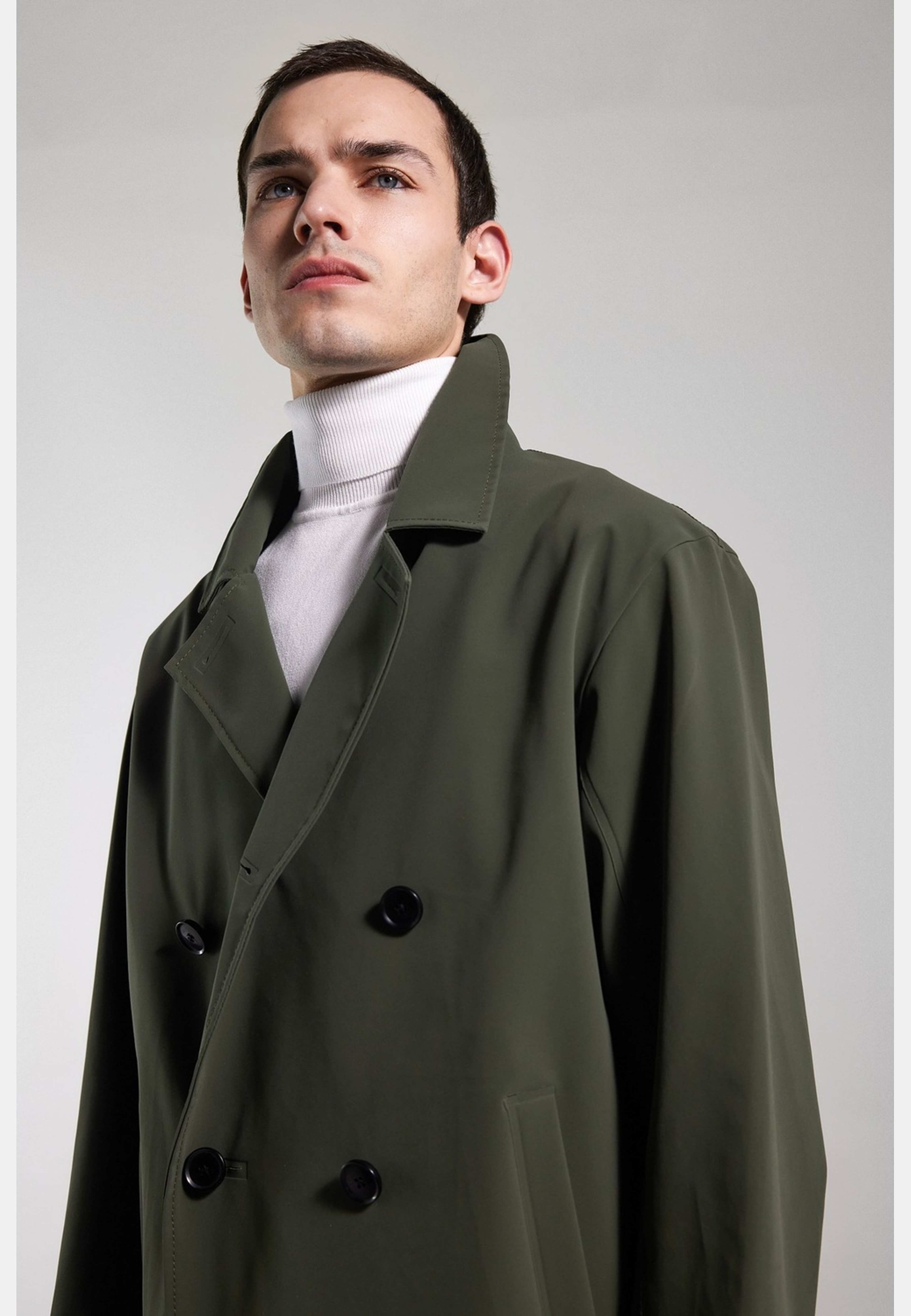 Åtvidaberg Raincoat, från Stutterheim, i färgen green. Klicka för att öppna bilden i stort format