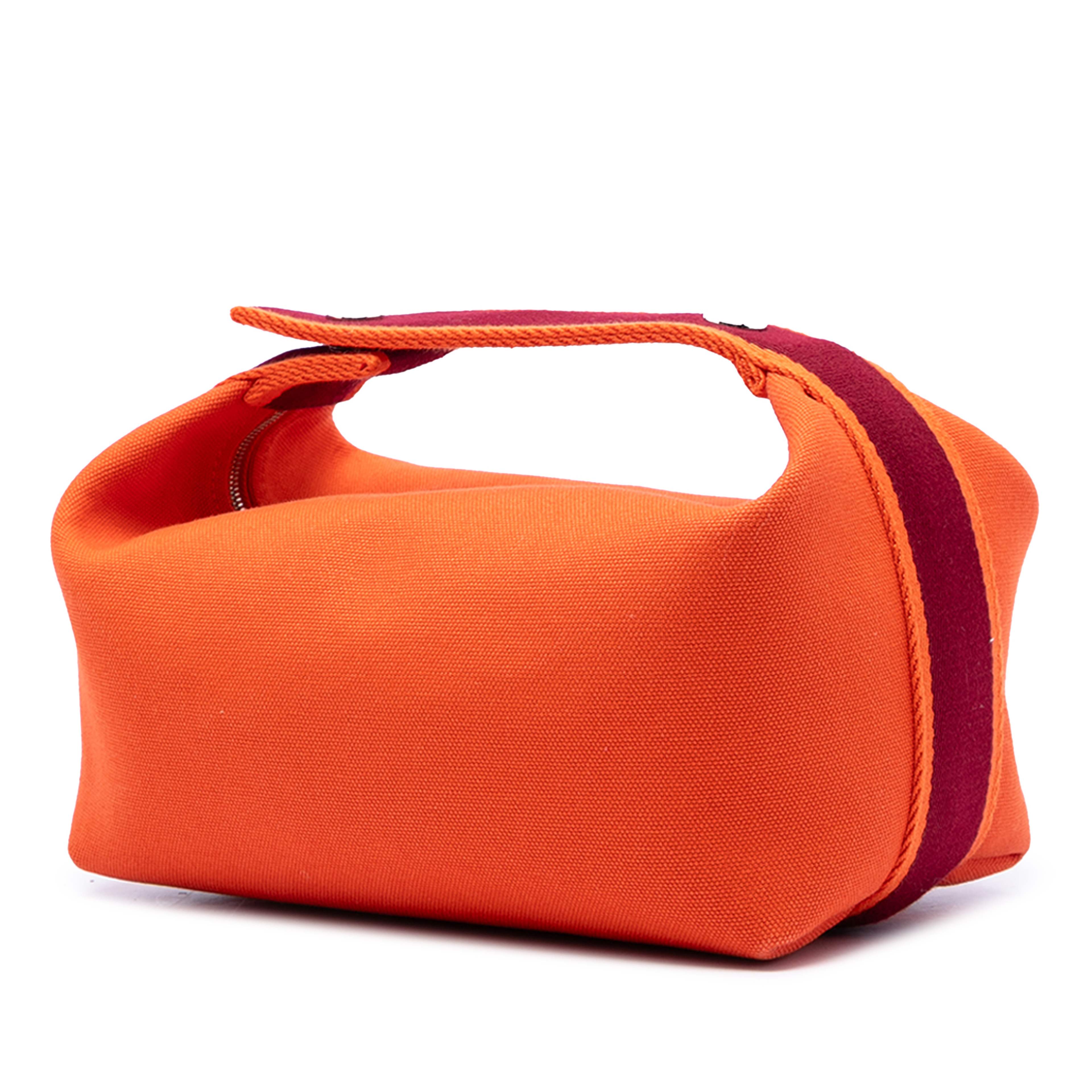 Hermès Small Toile Bride A Brac Case, från Luxclusif, i färgen orange. Klicka för att öppna bilden i stort format