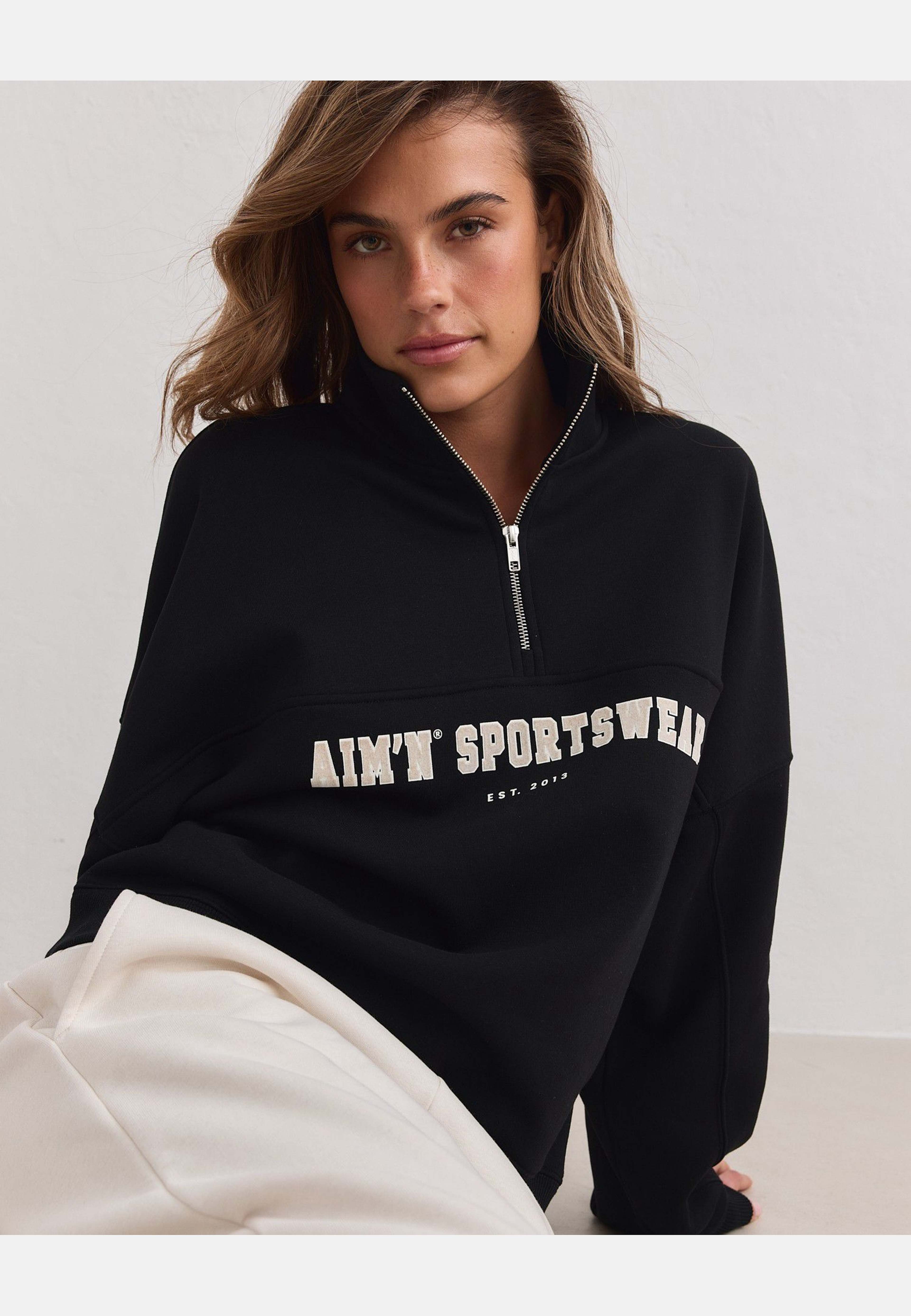 Varsity Sweat Half Zip, från aim'n, i färgen black. Klicka för att öppna bilden i stort format