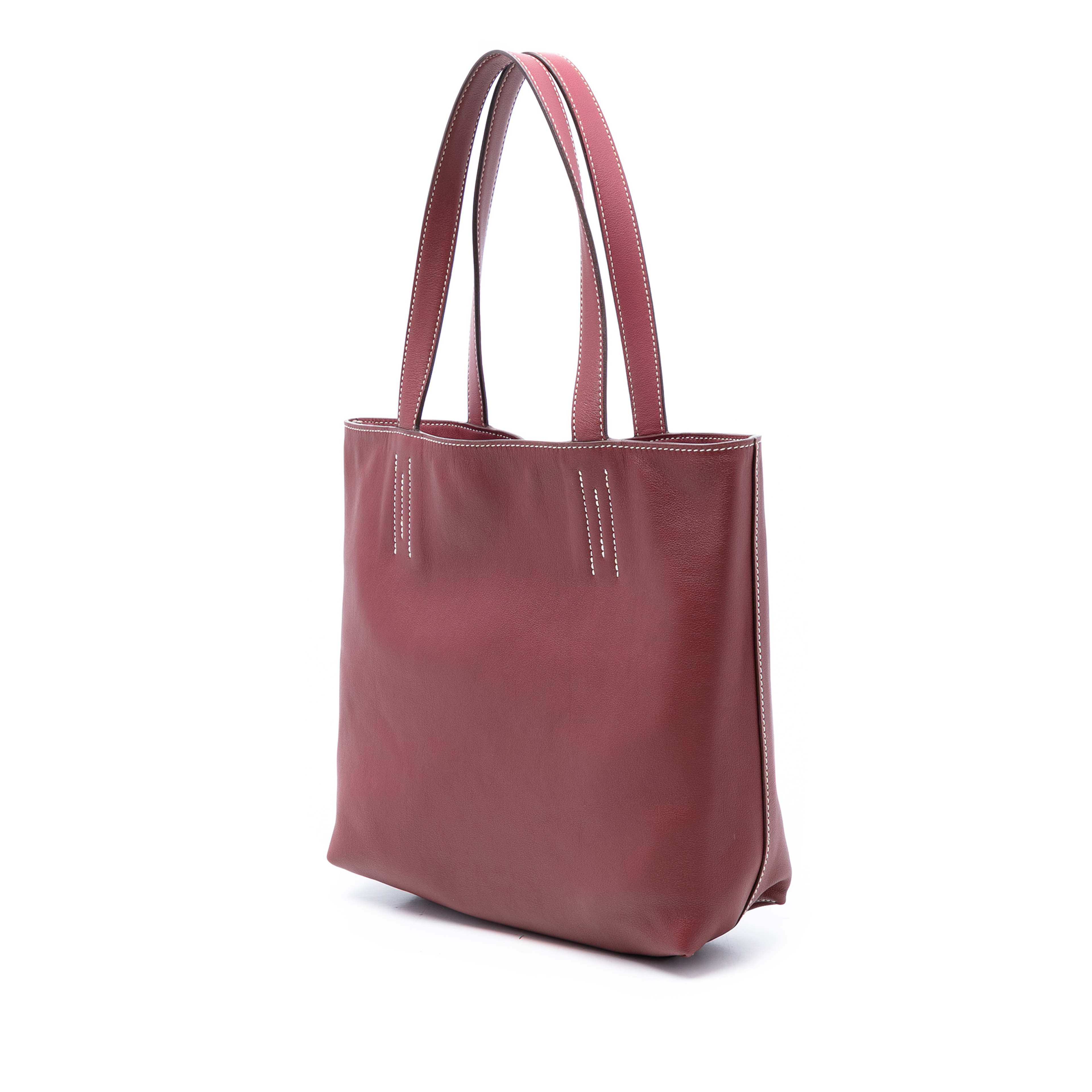 Hermès Swift And Veau Sikkim Double Sens 28, från Luxclusif, i färgen dark red. Klicka för att öppna bilden i stort format