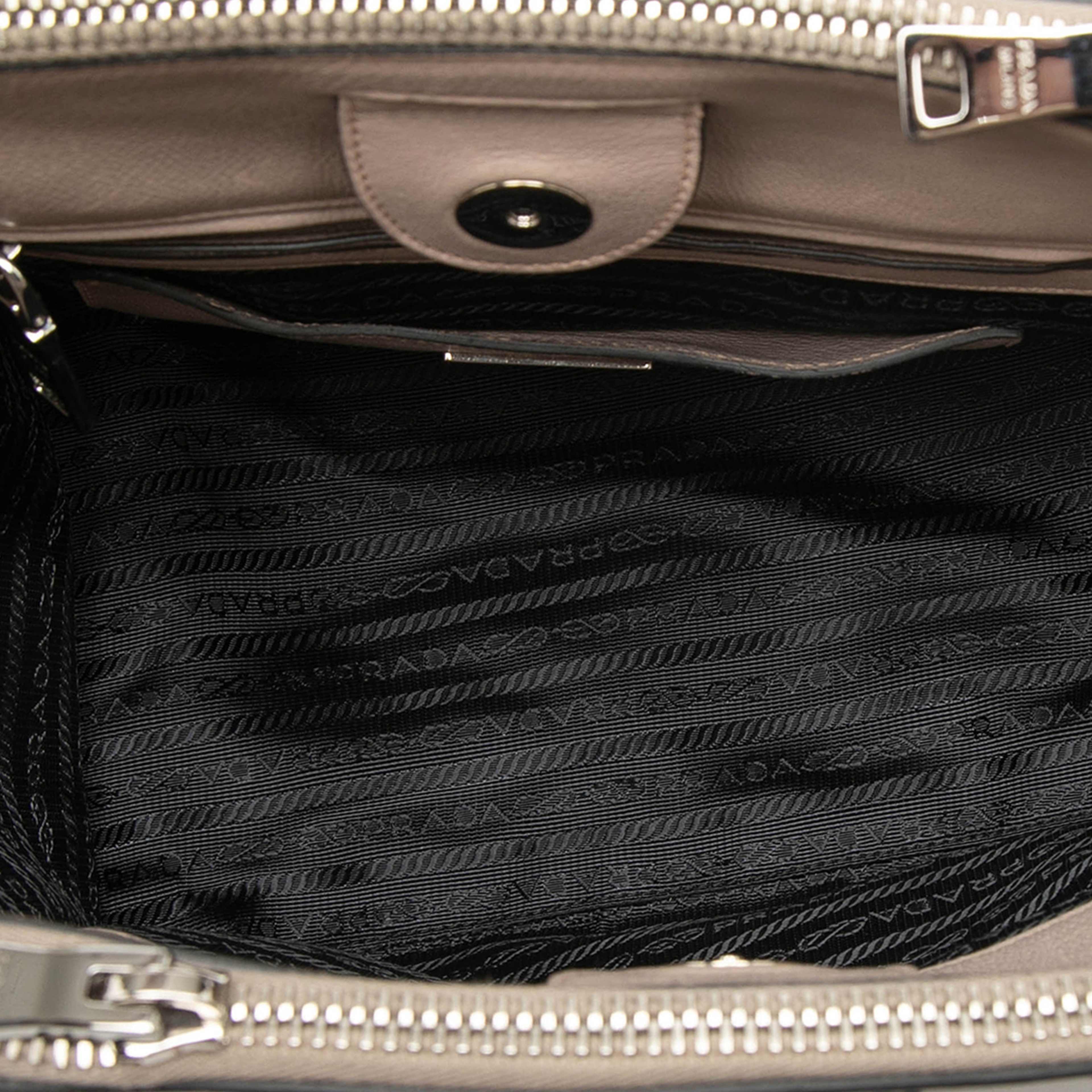 Prada Glace Calf Studded Twin Pocket Satchel, från Luxclusif, i färgen beige. Klicka för att öppna bilden i stort format