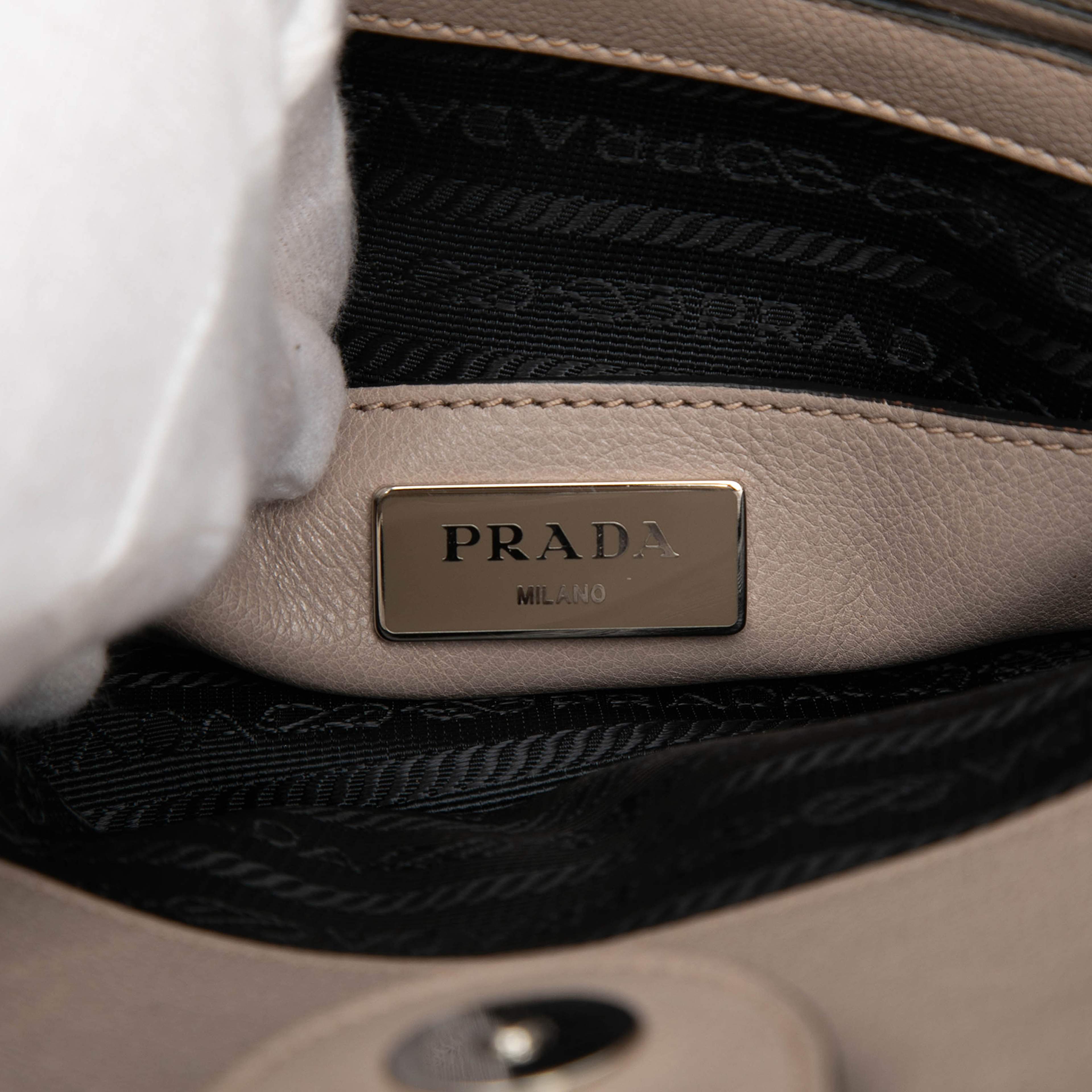 Prada Glace Calf Studded Twin Pocket Satchel, från Luxclusif, i färgen beige. Klicka för att öppna bilden i stort format
