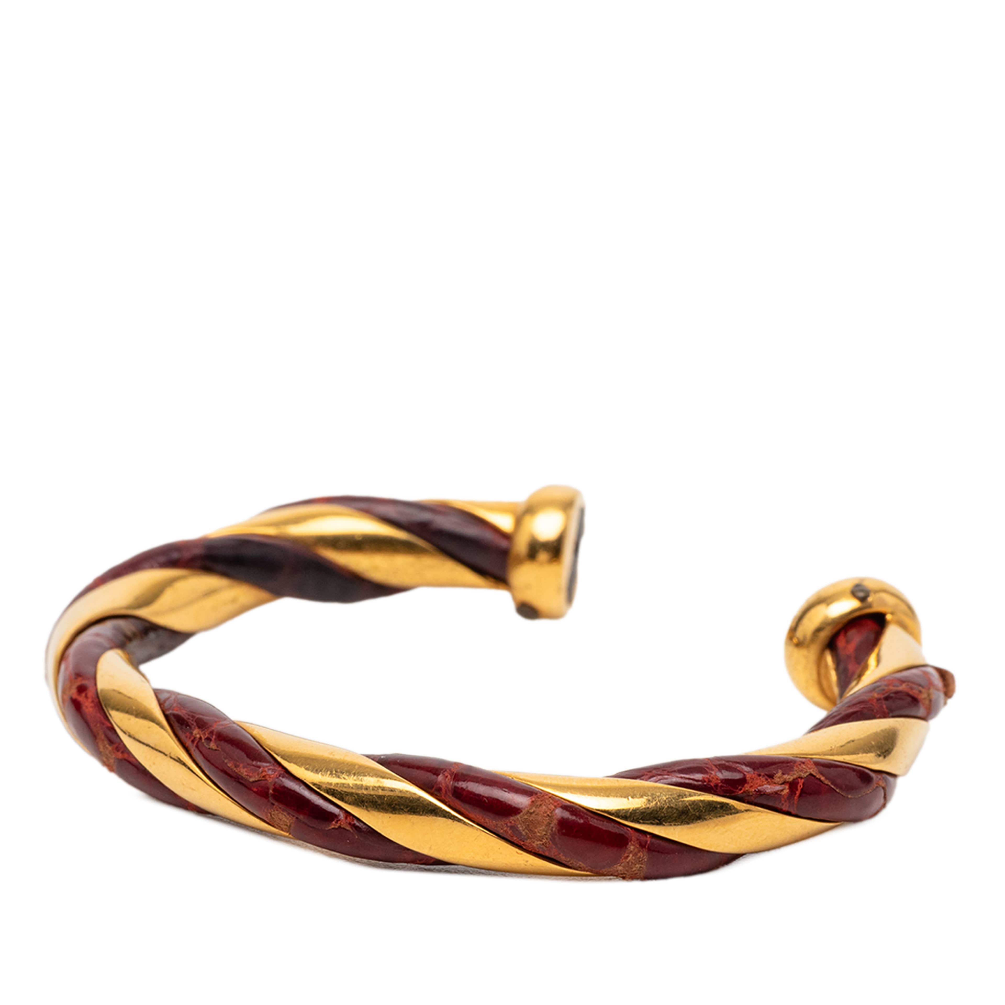 Hermès Gold Plated And Leather Twisted Cuff Bracelet, från Luxclusif, i färgen röd. Klicka för att öppna bilden i stort format