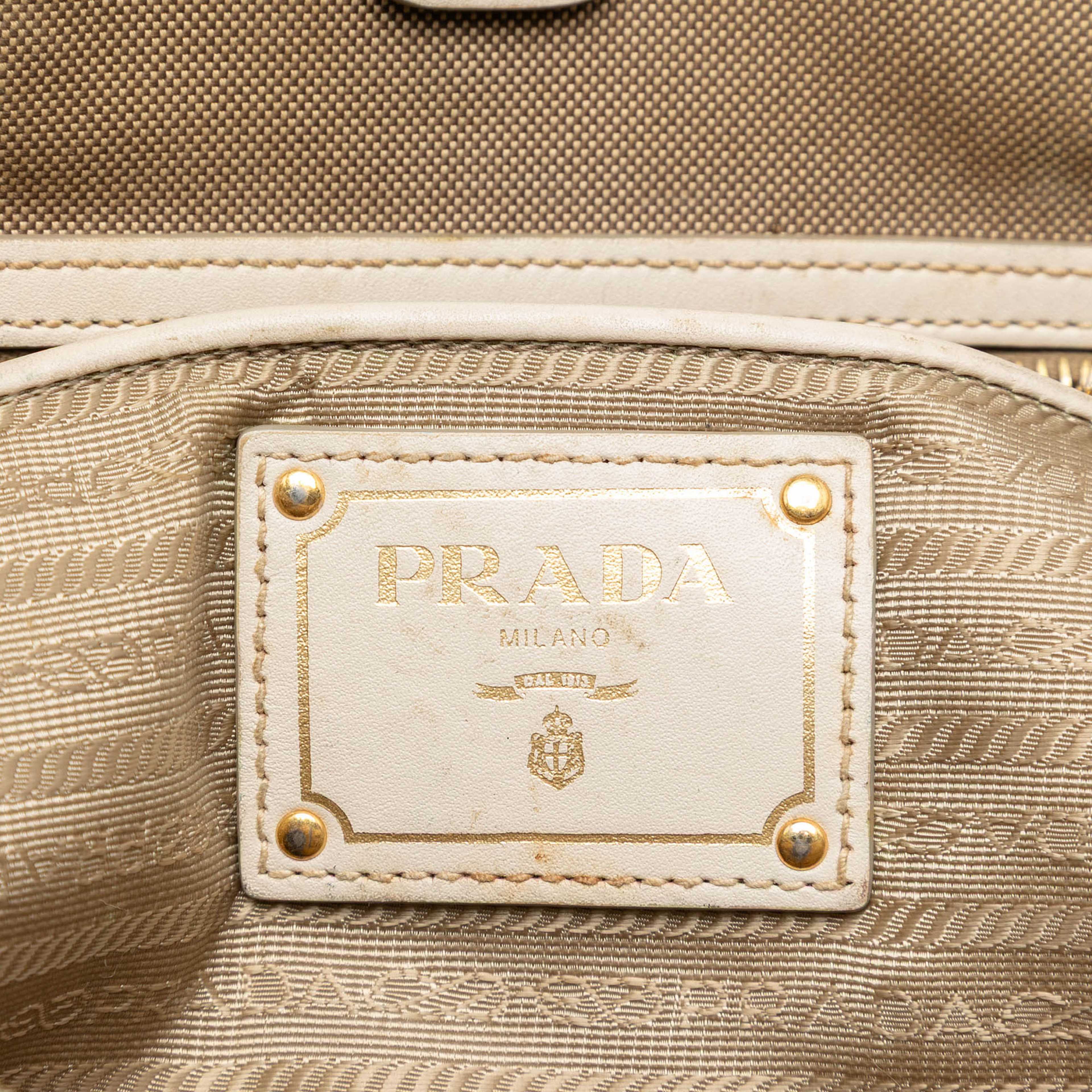 Prada Canvas Canapa Logo Bow Satchel, från Luxclusif, i färgen beige. Klicka för att öppna bilden i stort format