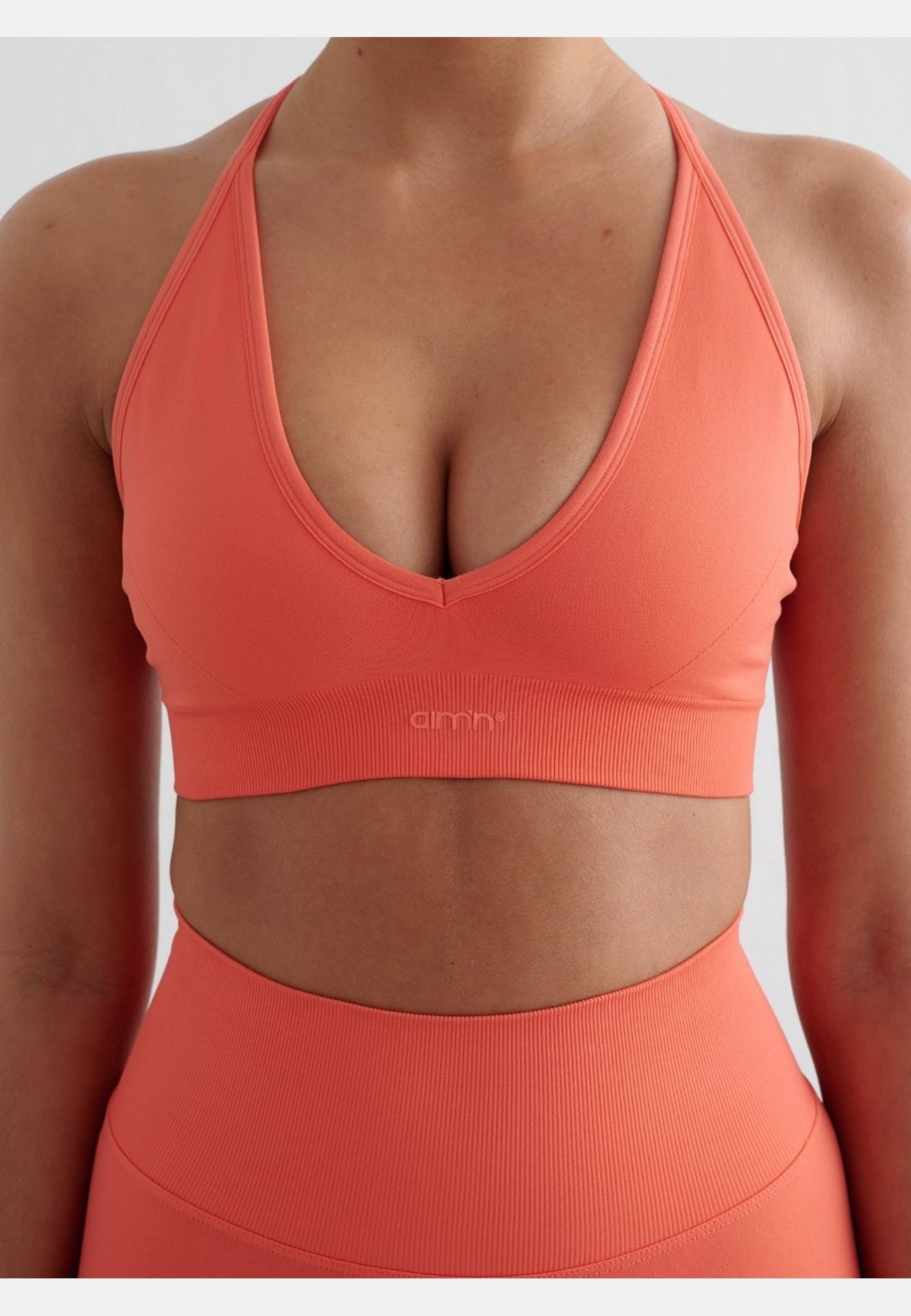 Shape Seamless Cross Back Bra, från aim'n, i färgen tangerine. Klicka för att öppna bilden i stort format